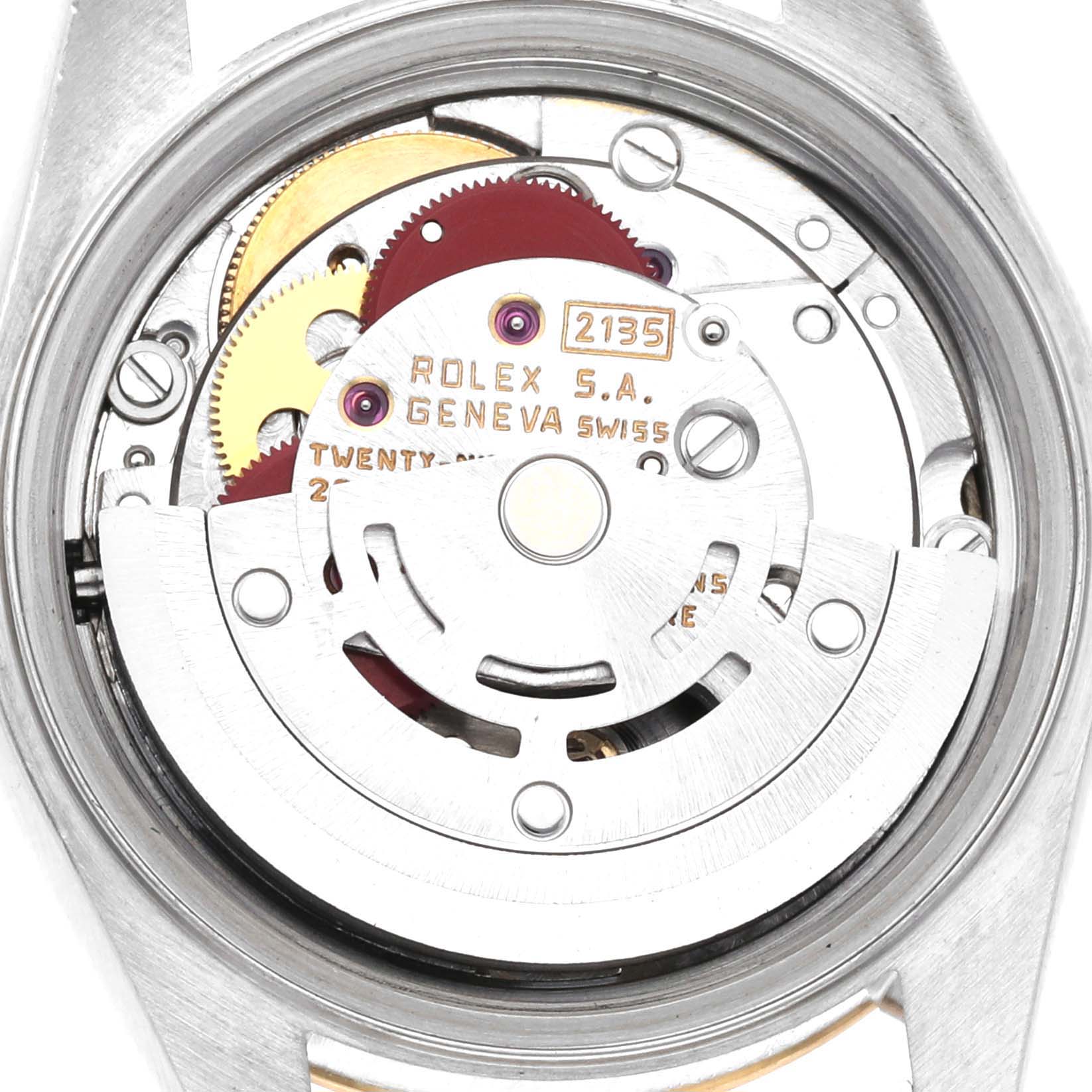 The image shows the internal mechanism of a Rolex Datejust 79163 Women's Steel and Gold (two tone) Champagne Dial 79163 Women's Steel and Gold (two tone) Champagne Dial, viewed from the back, revealing gears and engravings.