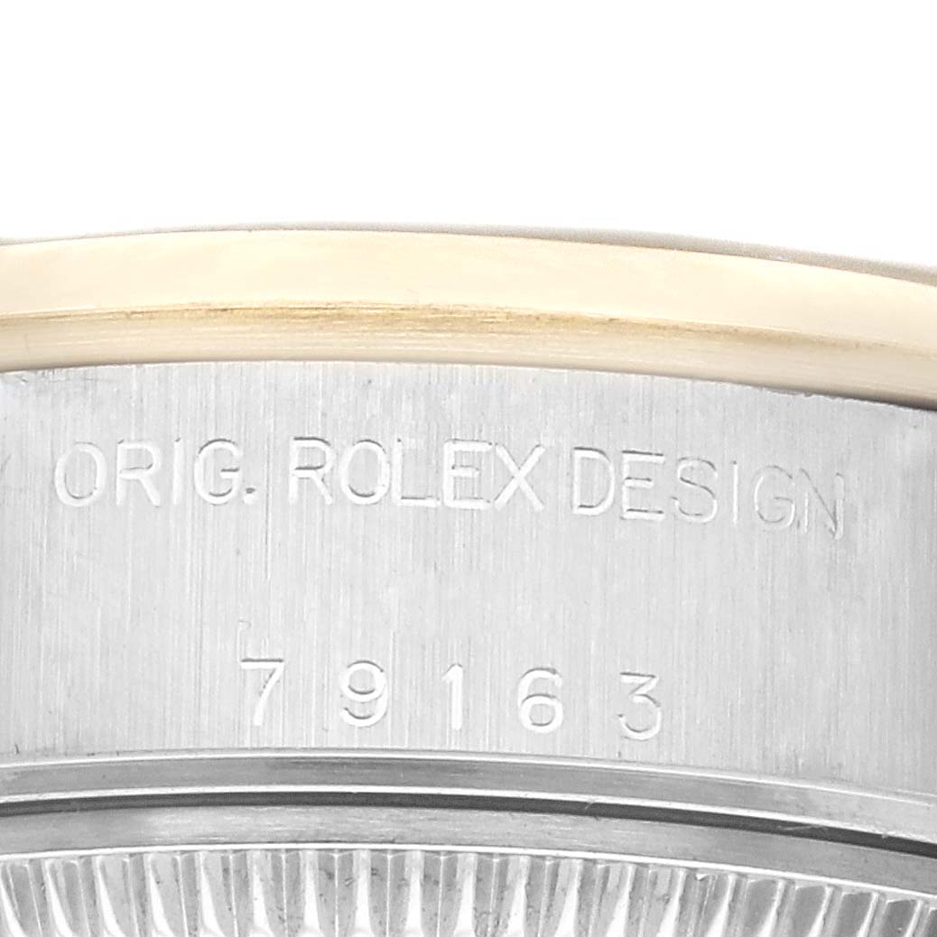 The image shows a close-up view of the casing number and the engraved "ORIG. ROLEX DESIGN" text on a Rolex Datejust 79163 Women's Steel and Gold (two tone) Champagne Dial 79163 Women's Steel and Gold (two tone) Champagne Dial watch.
