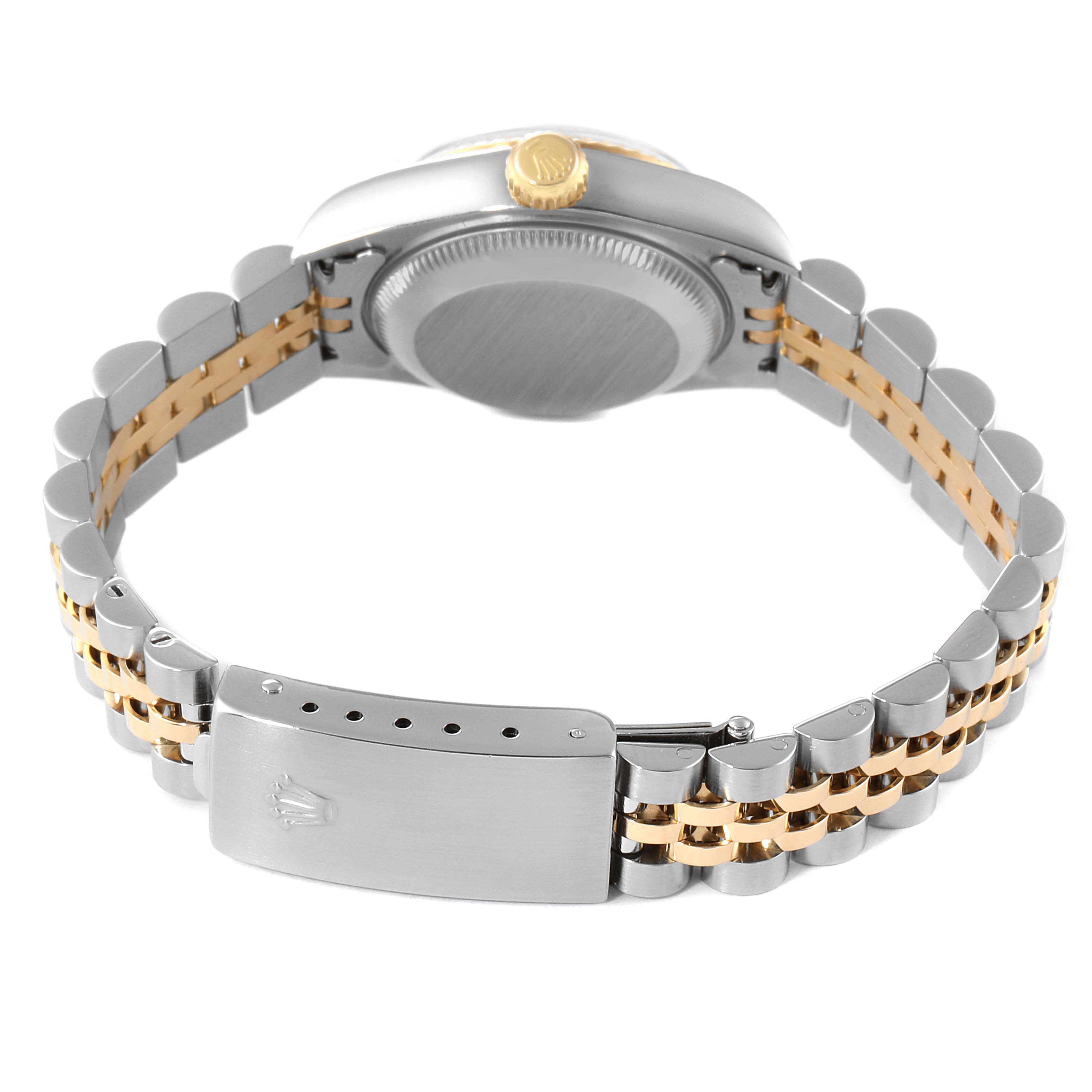 This image shows the back view of a Rolex Datejust 79173 Women
s Steel and Gold (two tone) Champagne Dial 79173 Women
s Steel and Gold (two tone) Champagne Dial watch, focusing on the clasp and bracelet with stainless steel and gold elements.