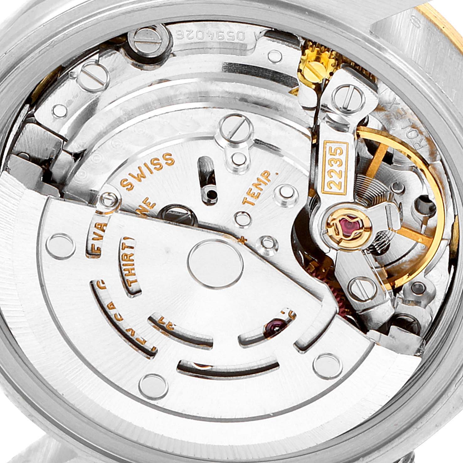 This image shows the intricate internal mechanism of a Rolex Datejust 79173 Women
s Steel and Gold (two tone) Champagne Dial 79173 Women
s Steel and Gold (two tone) Champagne Dial model watch from a close-up angle.