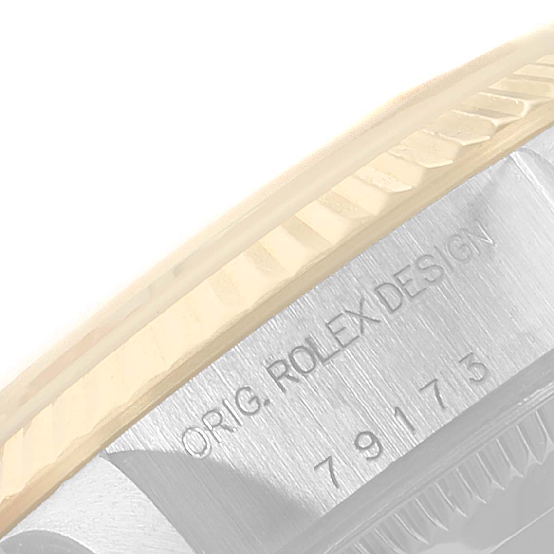 The image shows a close-up view of the side of a Rolex Datejust 79173 Women
s Steel and Gold (two tone) Champagne Dial 79173 Women
s Steel and Gold (two tone) Champagne Dial watch, highlighting the engraved model and design details.