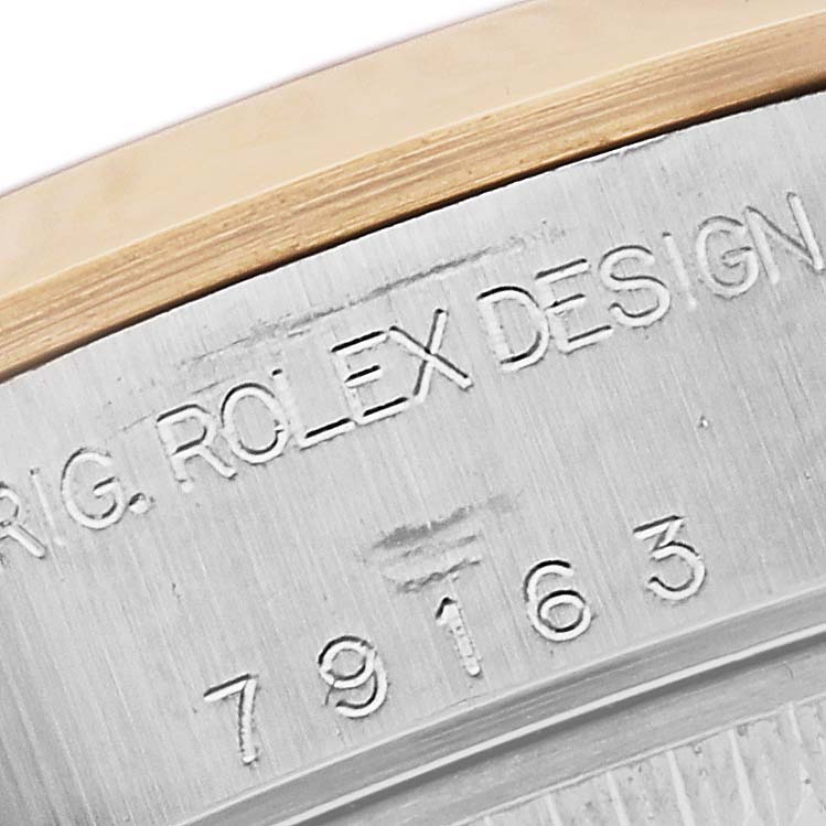 This image shows a close-up of the engraved model number on the case side of a Rolex Datejust 79163 Women's Steel and Gold (two tone) Grey Dial 79163 Women's Steel and Gold (two tone) Grey Dial watch.
