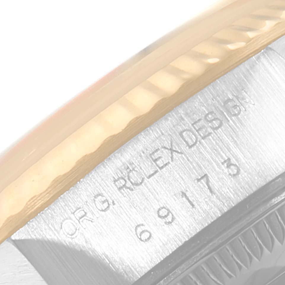 The image shows a close-up of the bezel and the case edge of a Rolex Datejust 69173 Women's Steel and Gold (two tone) White Dial 69173 Women's Steel and Gold (two tone) White Dial watch, featuring the model number 69173.