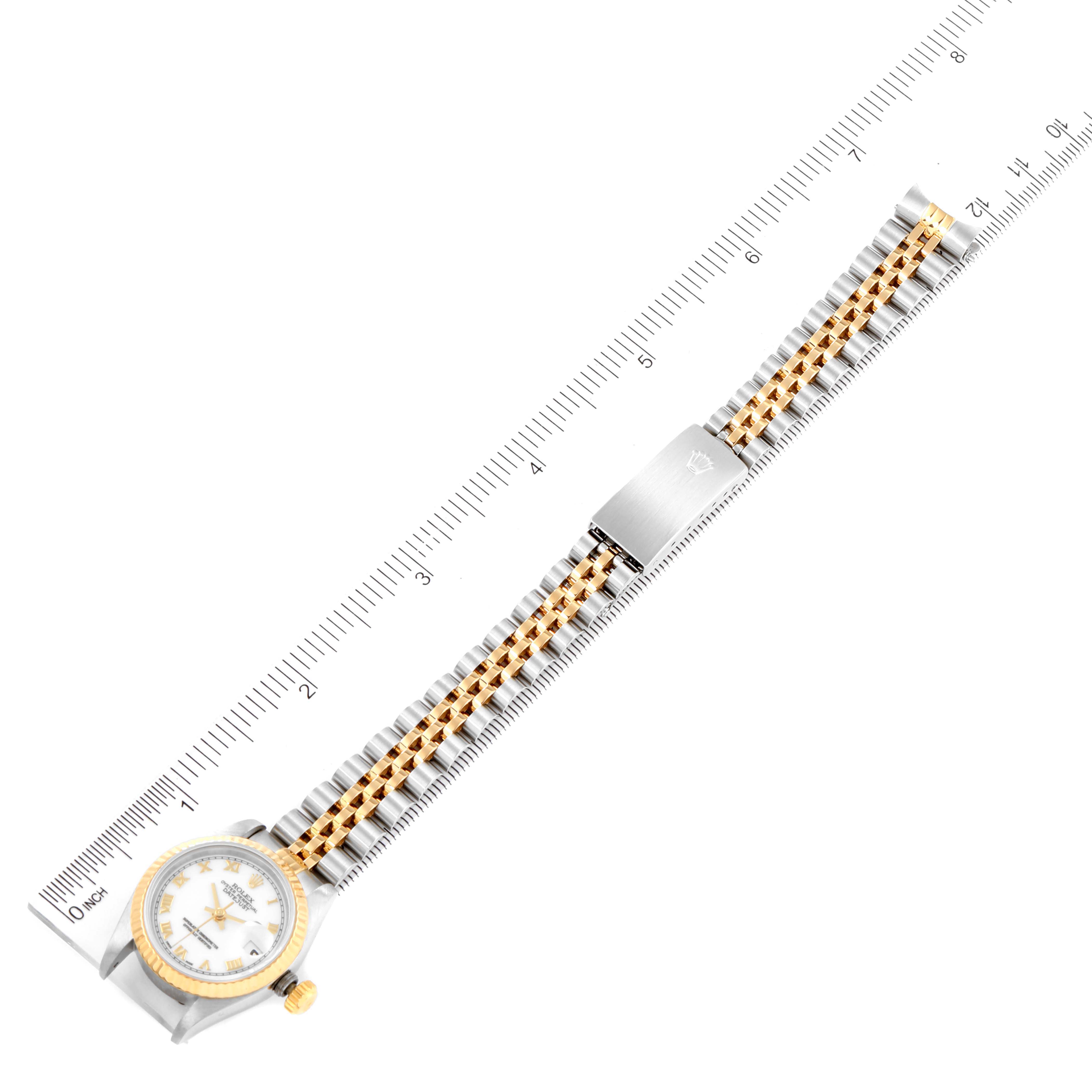 This image shows a Rolex Datejust 69173 Women's Steel and Gold (two tone) White Dial 69173 Women's Steel and Gold (two tone) White Dial watch laid flat with both the case and bracelet fully visible against a ruler for scale.