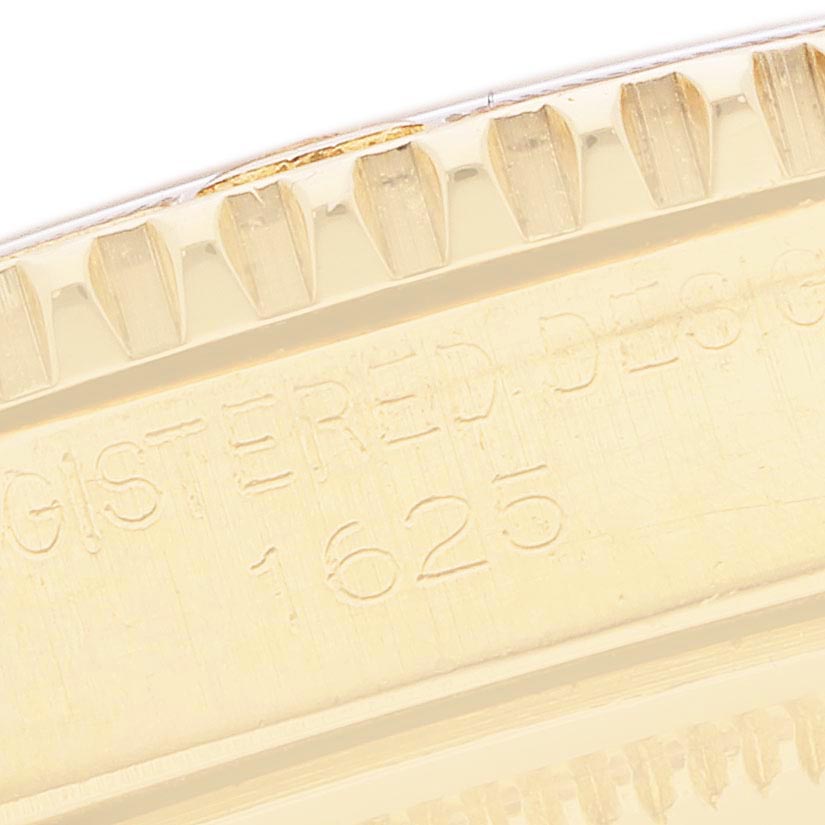 The image shows a close-up of the fluted bezel and engraved inner ring of the Rolex Turn-o-Graph 1625 Men
s Yellow Gold Champagne Dial 1625 Men
s Yellow Gold Champagne Dial model, including the reference number.