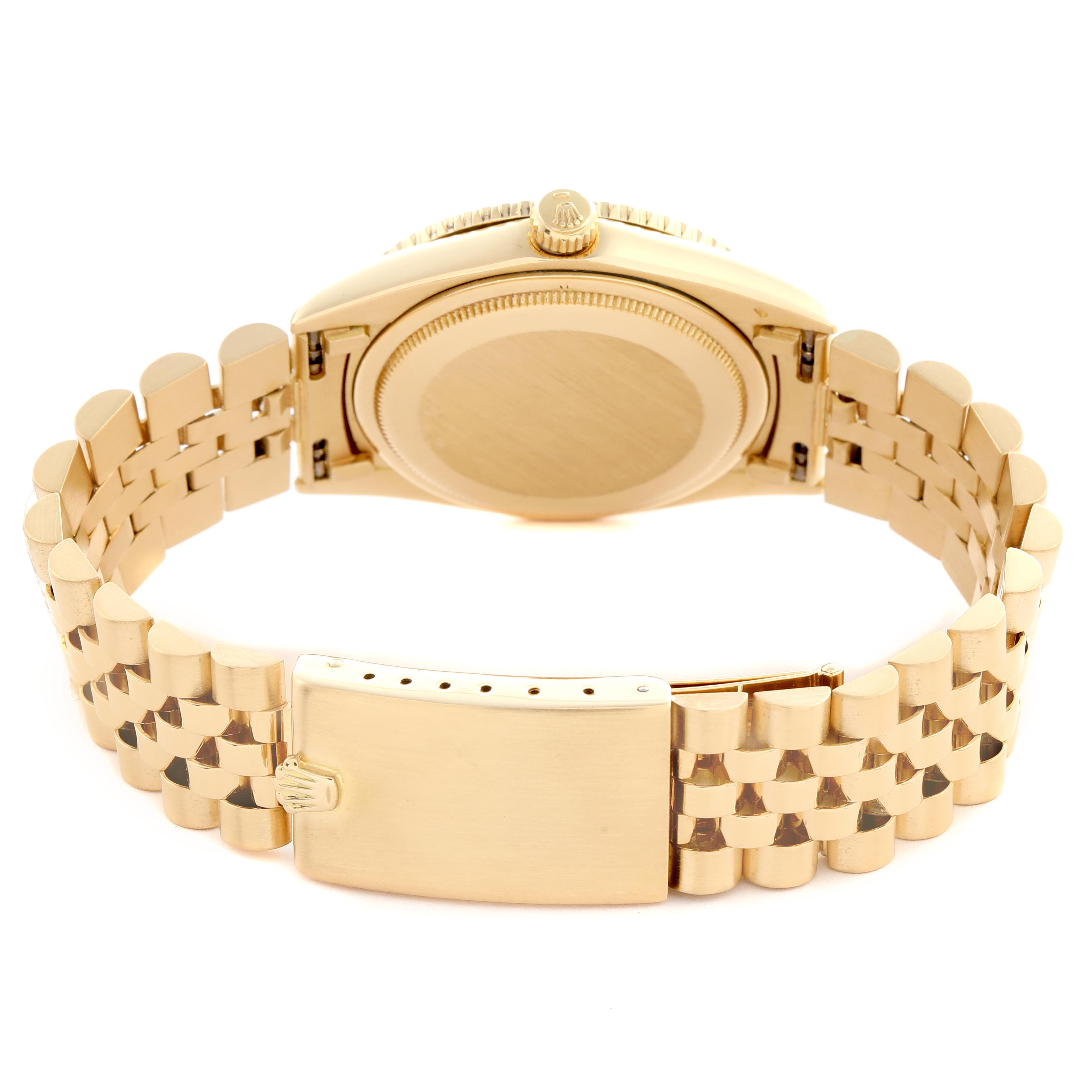 The image shows the back view of a Rolex Turn-o-Graph 1625 Men
s Yellow Gold Champagne Dial 1625 Men
s Yellow Gold Champagne Dial watch, highlighting the bracelet and clasp.