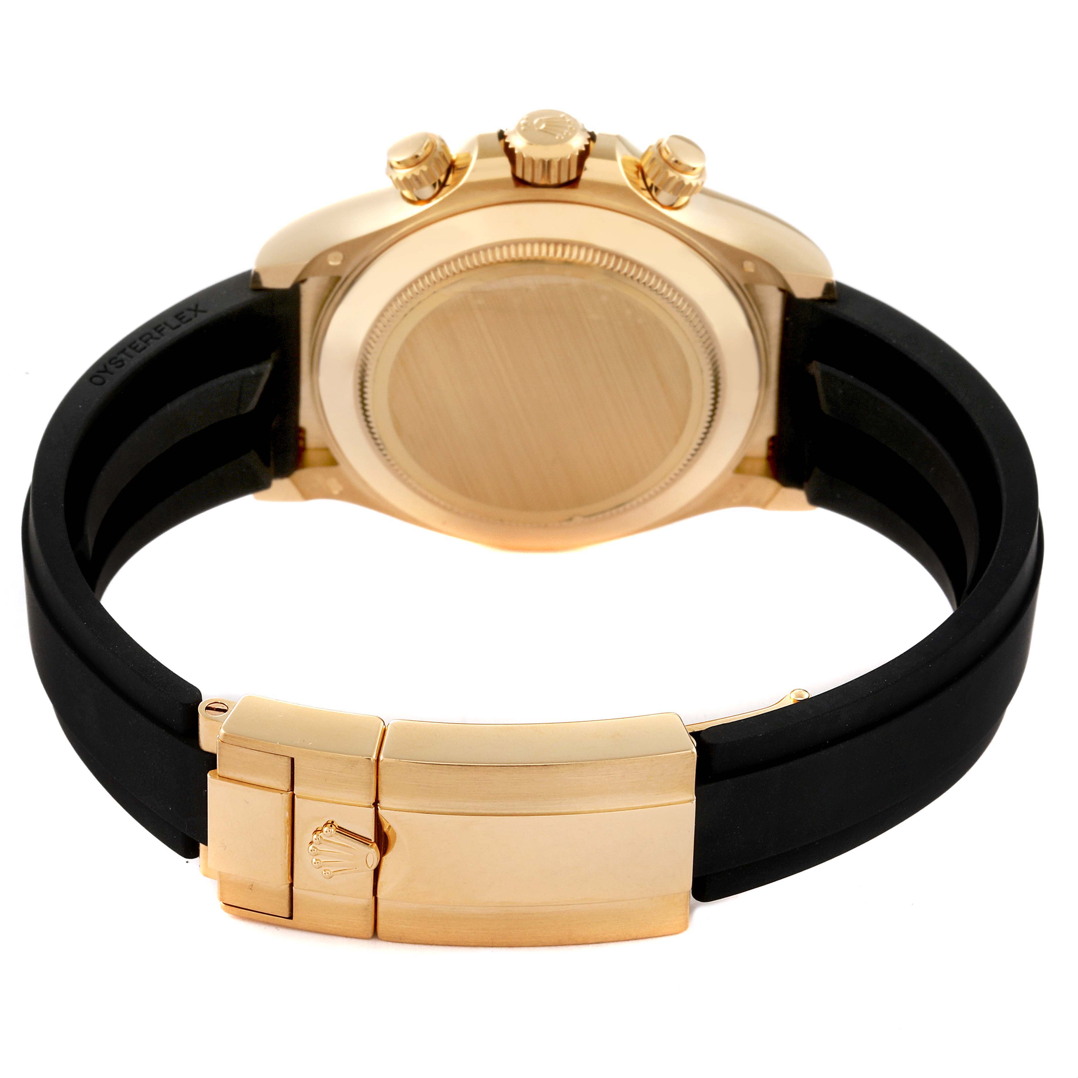 This image shows the back view of a Rolex Daytona 116518 Men's Yellow Gold Champagne Dial 116518 Men's Yellow Gold Champagne Dial watch, highlighting its case, crown, pushers, and black rubber strap with a clasp.