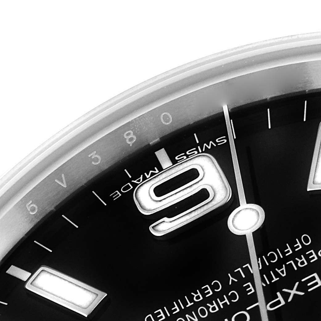 The image shows a close-up of the dial on the Rolex Explorer 214270 Men's Stainless Steel Black Dial 214270 Men's Stainless Steel Black Dial, focusing on the 6 o'clock marker and surrounding details.