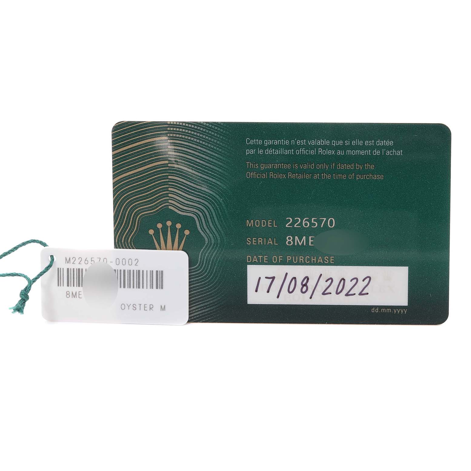 The image shows the warranty card and tag for the Rolex Explorer M226570-0002 Men's Stainless Steel Black Dial M226570-0002 Men's Stainless Steel Black Dial model 226570 watch, including the model, serial number, and purchase date.