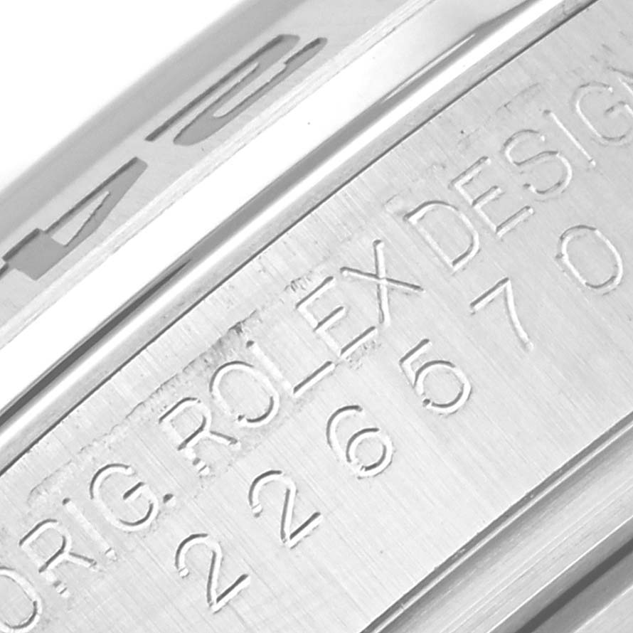 The image shows a close-up of the engraved side of the case of a Rolex Explorer M226570-0002 Men's Stainless Steel Black Dial M226570-0002 Men's Stainless Steel Black Dial watch.