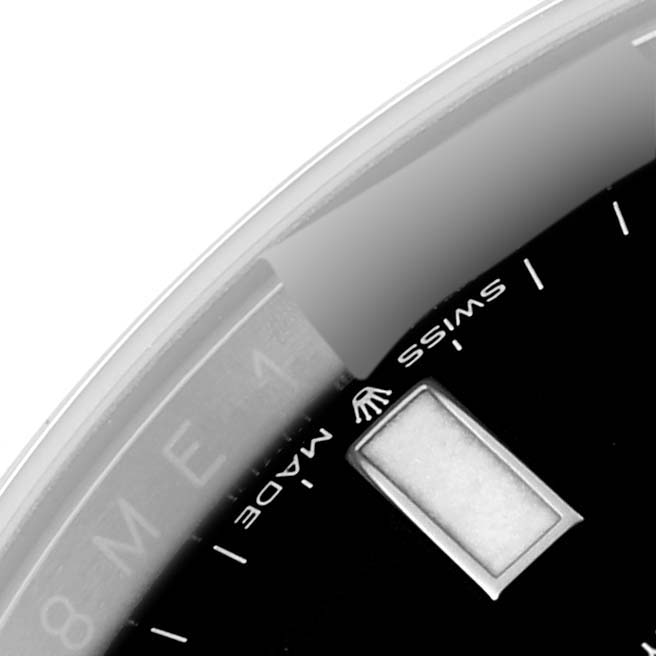 The image shows a close-up of the dial and part of the date window on a Rolex Explorer M226570-0002 Men's Stainless Steel Black Dial M226570-0002 Men's Stainless Steel Black Dial watch.