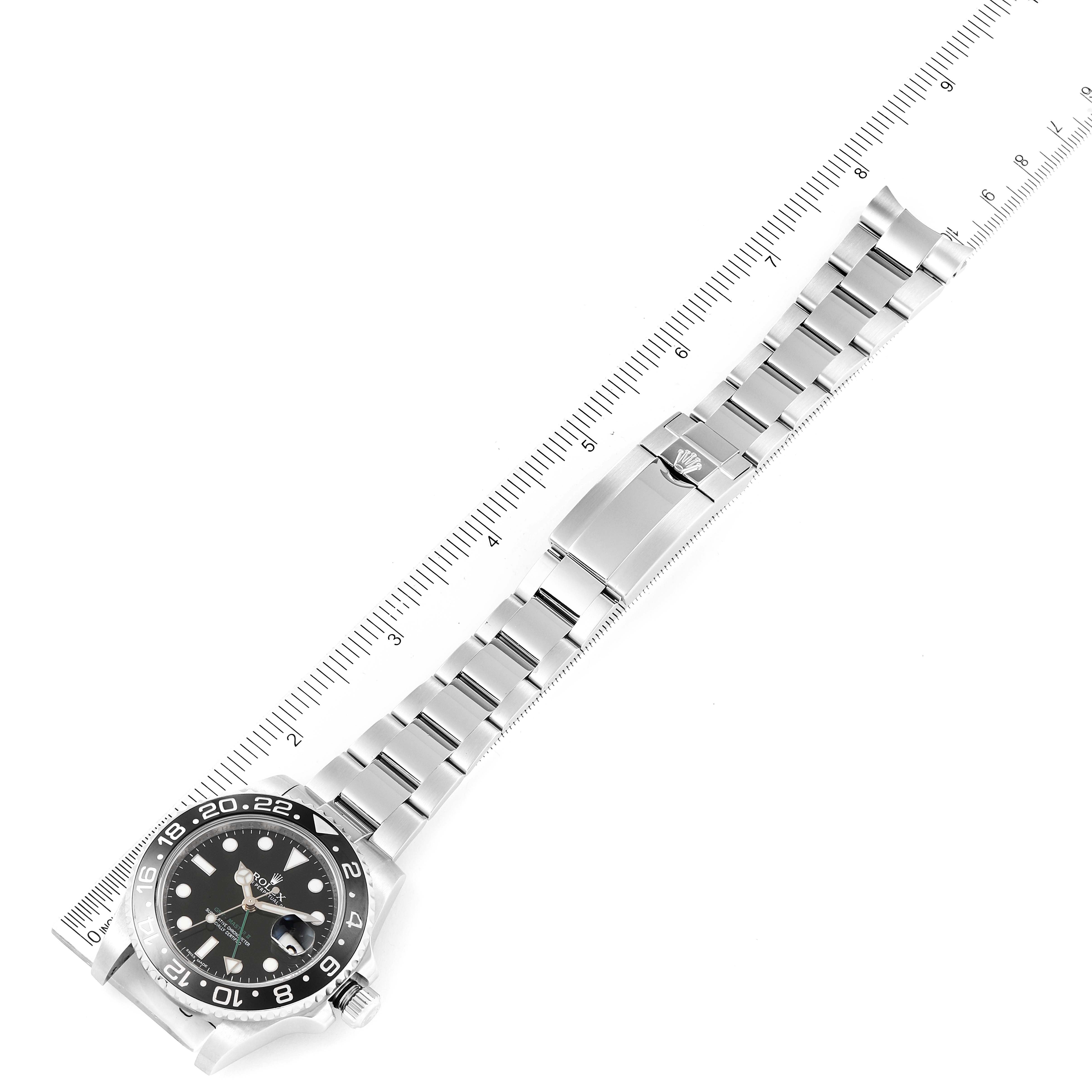 The image shows the Rolex GMT-Master 116710 Men
s Stainless Steel Black Dial 116710 Men
s Stainless Steel Black Dial watch laid flat at an overhead angle with its face, bezel, bracelet, and clasp visible.