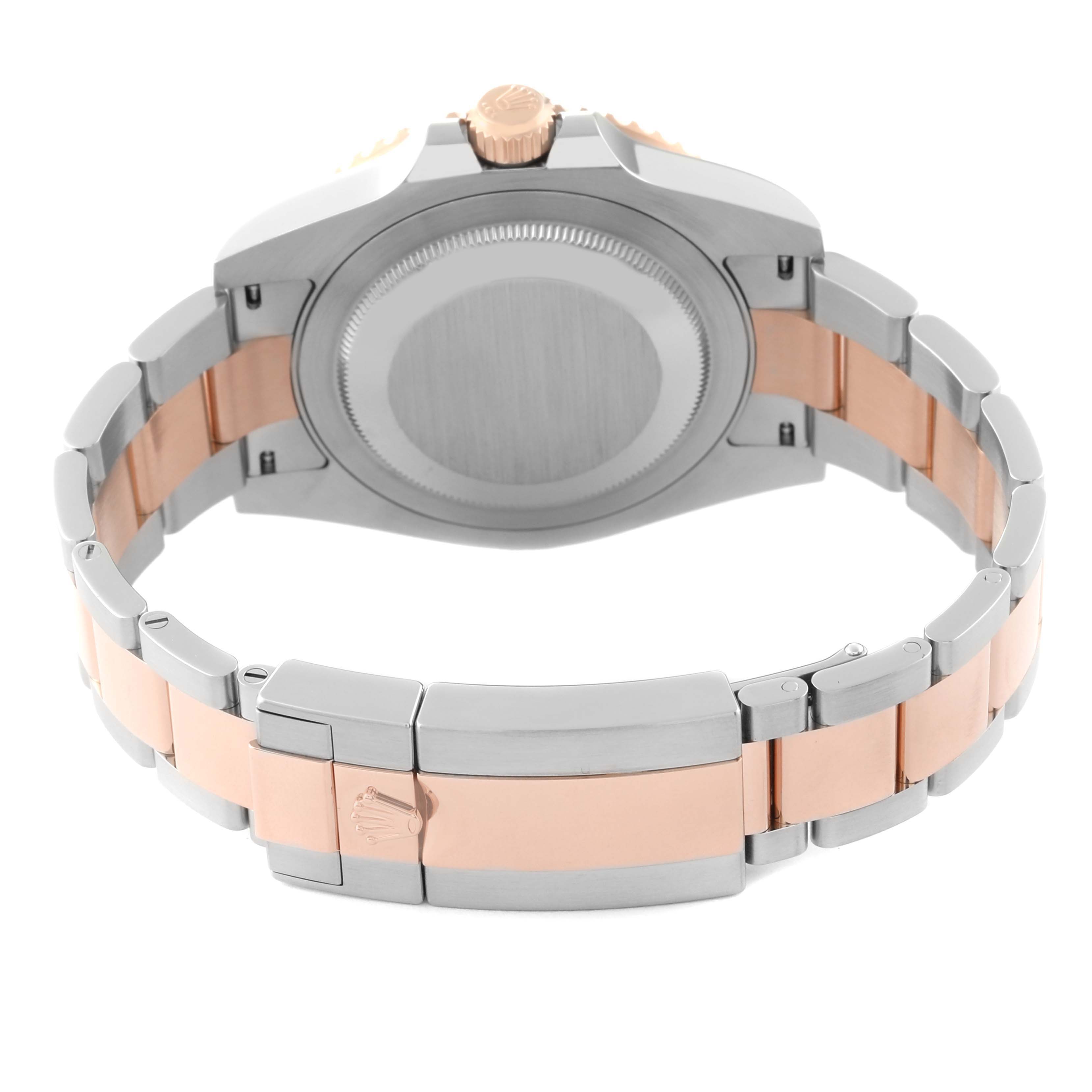 The image shows the case back, crown, and bracelet of a Rolex GMT-Master 126711CHNR Men's Steel and Gold (two tone) Black Dial 126711CHNR Men's Steel and Gold (two tone) Black Dial watch from the rear angle.