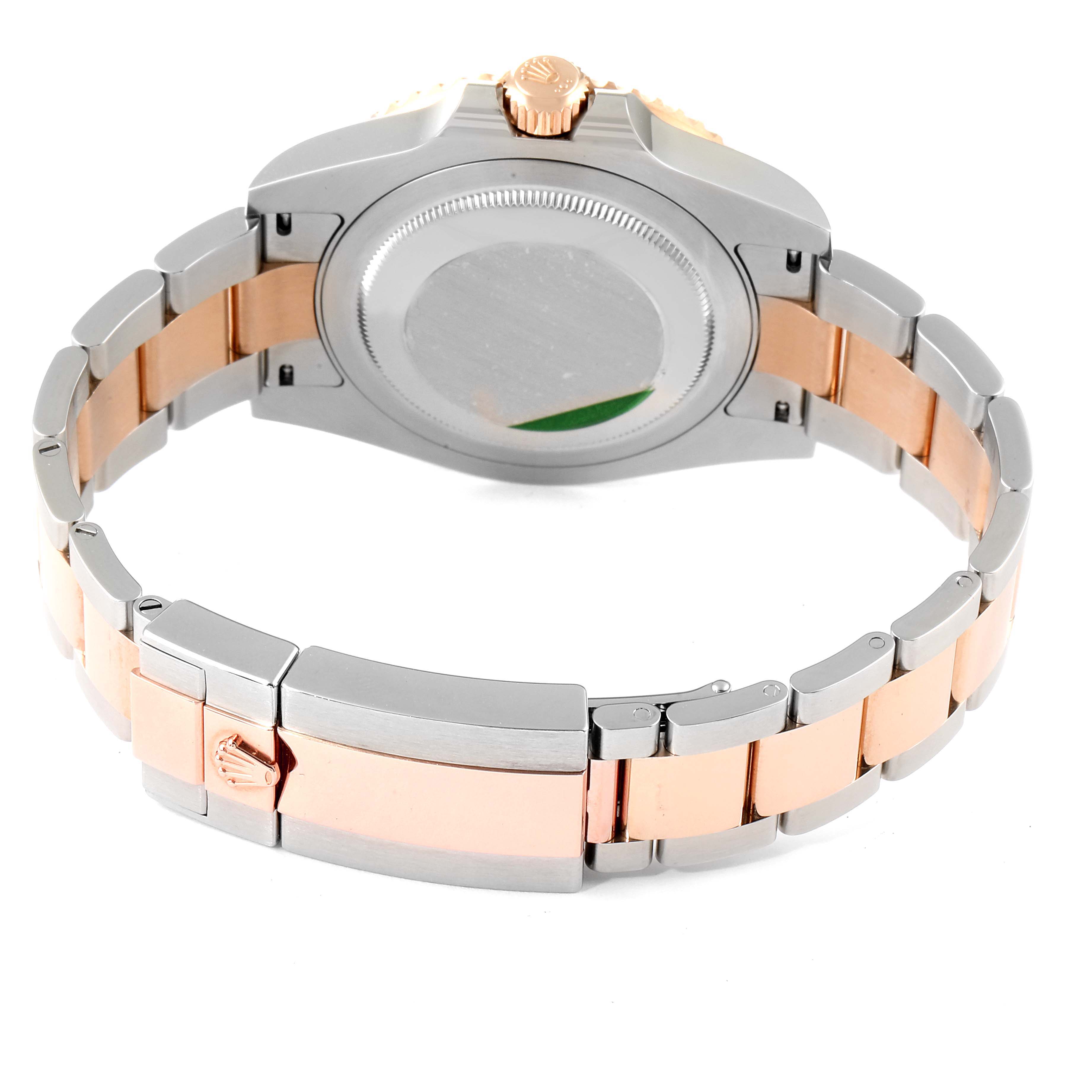 The image shows the back view of a Rolex GMT-Master 126711 Men
s Steel and Gold (two tone) Black Dial 126711 Men
s Steel and Gold (two tone) Black Dial with its stainless steel and gold bracelet.