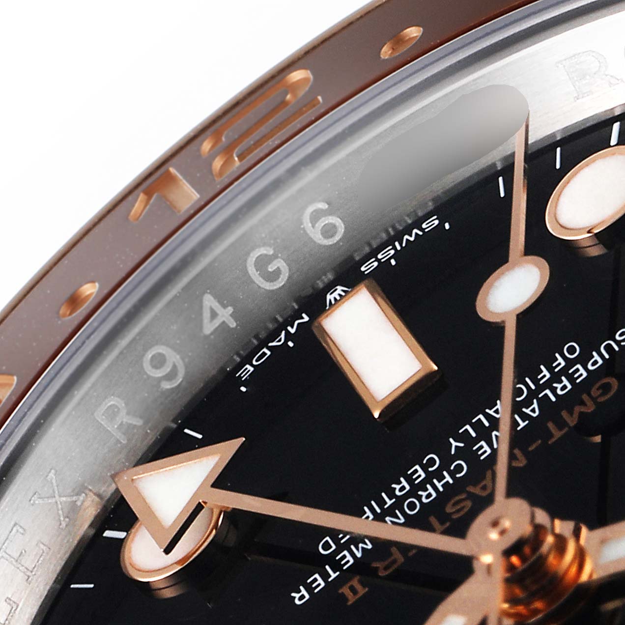 The angle shows a close-up of the face of a Rolex GMT-Master 126711 Men
s Steel and Gold (two tone) Black Dial 126711 Men
s Steel and Gold (two tone) Black Dial watch, focusing on the dial and the edge of the bezel.