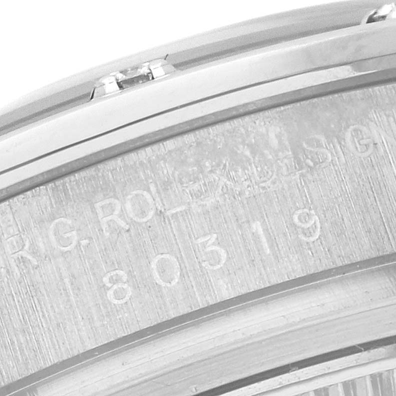 This image shows a close-up of the case back edge of the Rolex Pearlmaster 80319 Women's White Gold Mother of Pearl Dial 80319 Women's White Gold Mother of Pearl Dial watch, highlighting engravings.