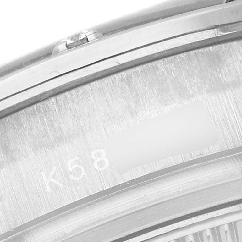 This image shows a close-up of the side view of a Rolex Pearlmaster 80319 Women's White Gold Mother of Pearl Dial 80319 Women's White Gold Mother of Pearl Dial watch, highlighting the serial engraving on the metal casing.