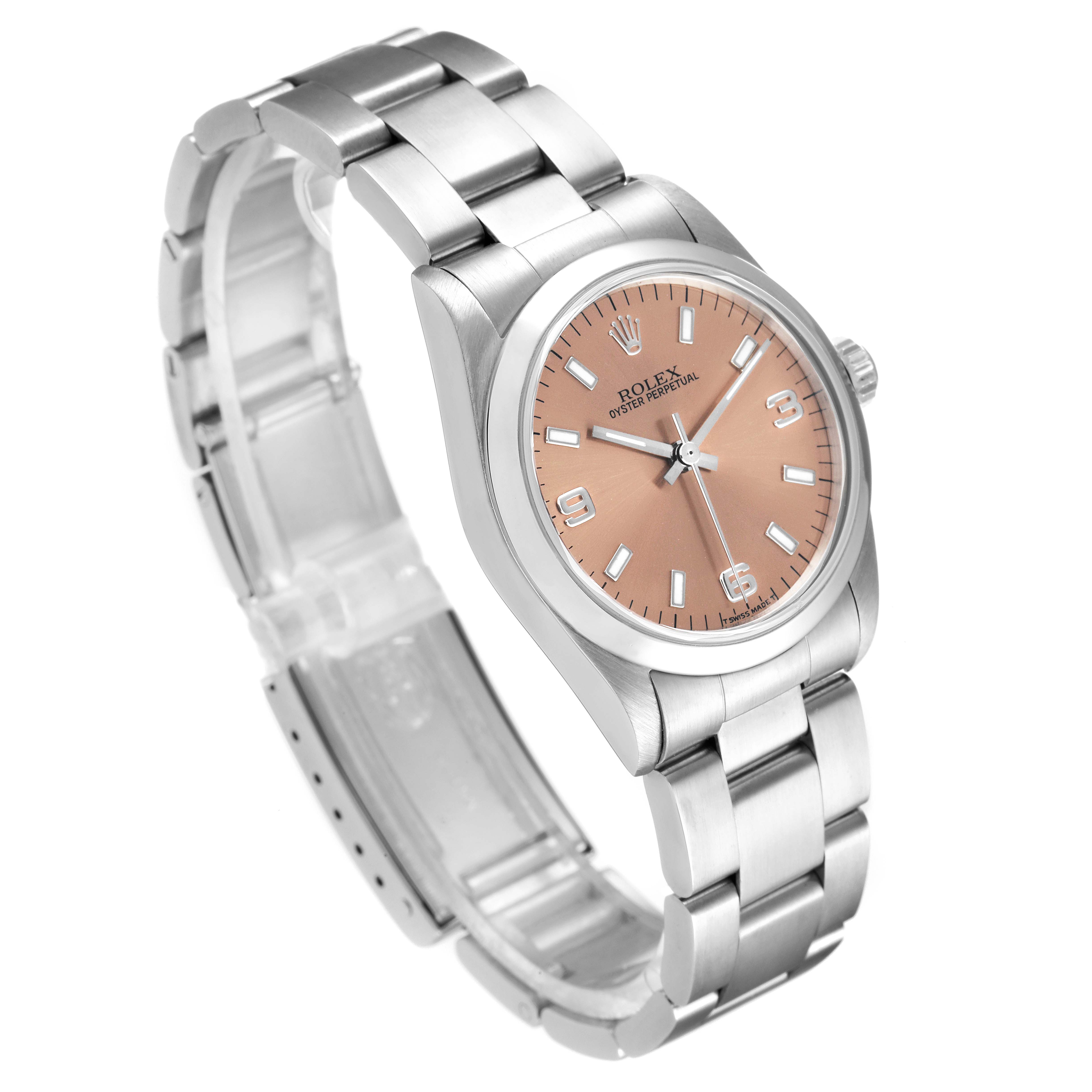 This image shows a Rolex Mid-Size 67480 Women's Stainless Steel Pink Dial 67480 Women's Stainless Steel Pink Dial Oyster Perpetual watch from a front-left angle, revealing the bracelet and peach dial.