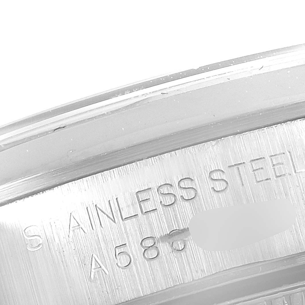 This image shows a close-up of the stainless steel case of a Rolex Oyster Perpetual 76080 Women
s Stainless Steel Blue Dial 76080 Women
s Stainless Steel Blue Dial watch.