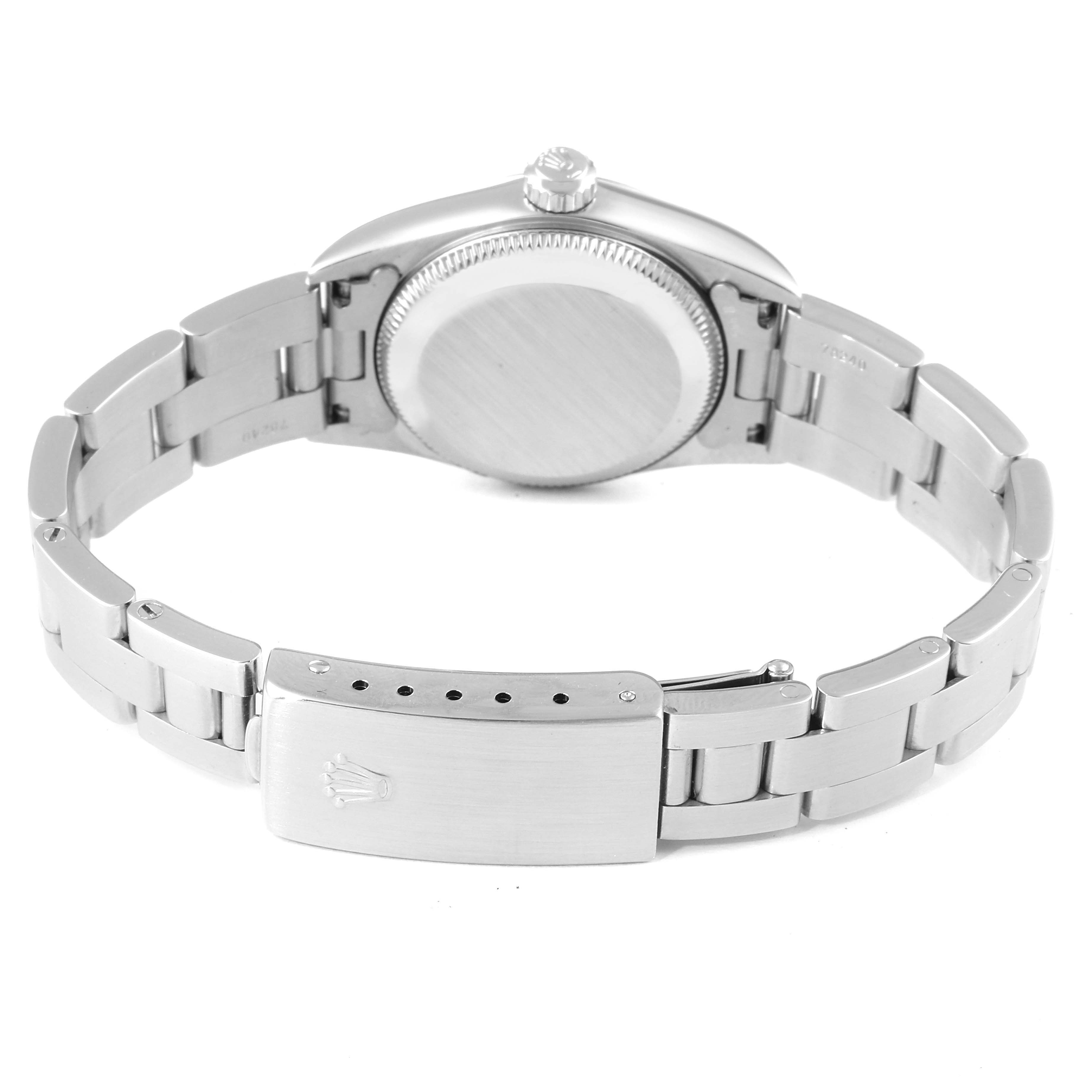 The image shows the back view of a Rolex Oyster Perpetual 76080 Women
s Stainless Steel Blue Dial 76080 Women
s Stainless Steel Blue Dial watch, highlighting the case back and metal bracelet clasp.