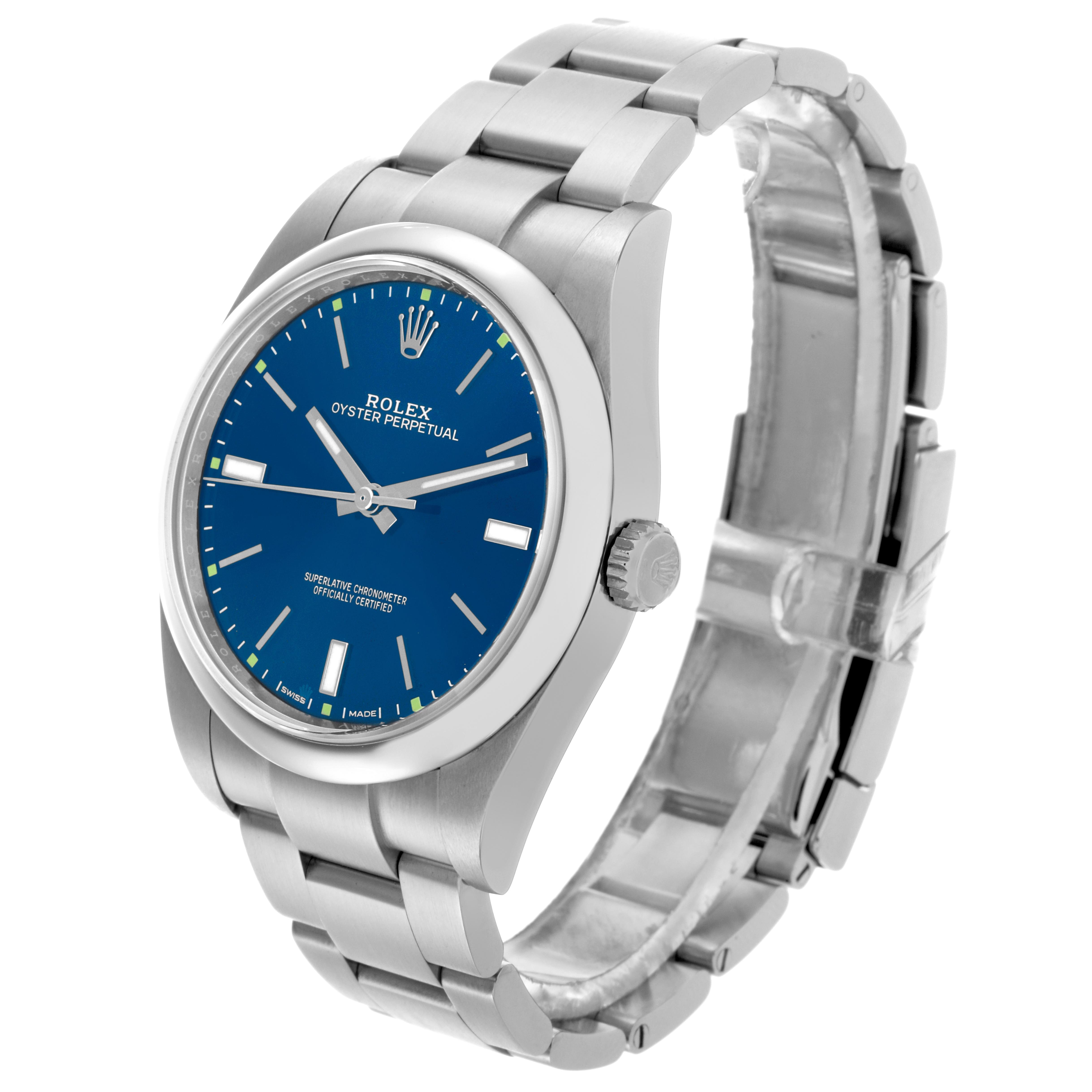 The Rolex Oyster Perpetual 114300 Men's Stainless Steel Blue Dial 114300 Men's Stainless Steel Blue Dial watch is shown at a three-quarter angle, displaying the face, crown, and part of the metal bracelet.