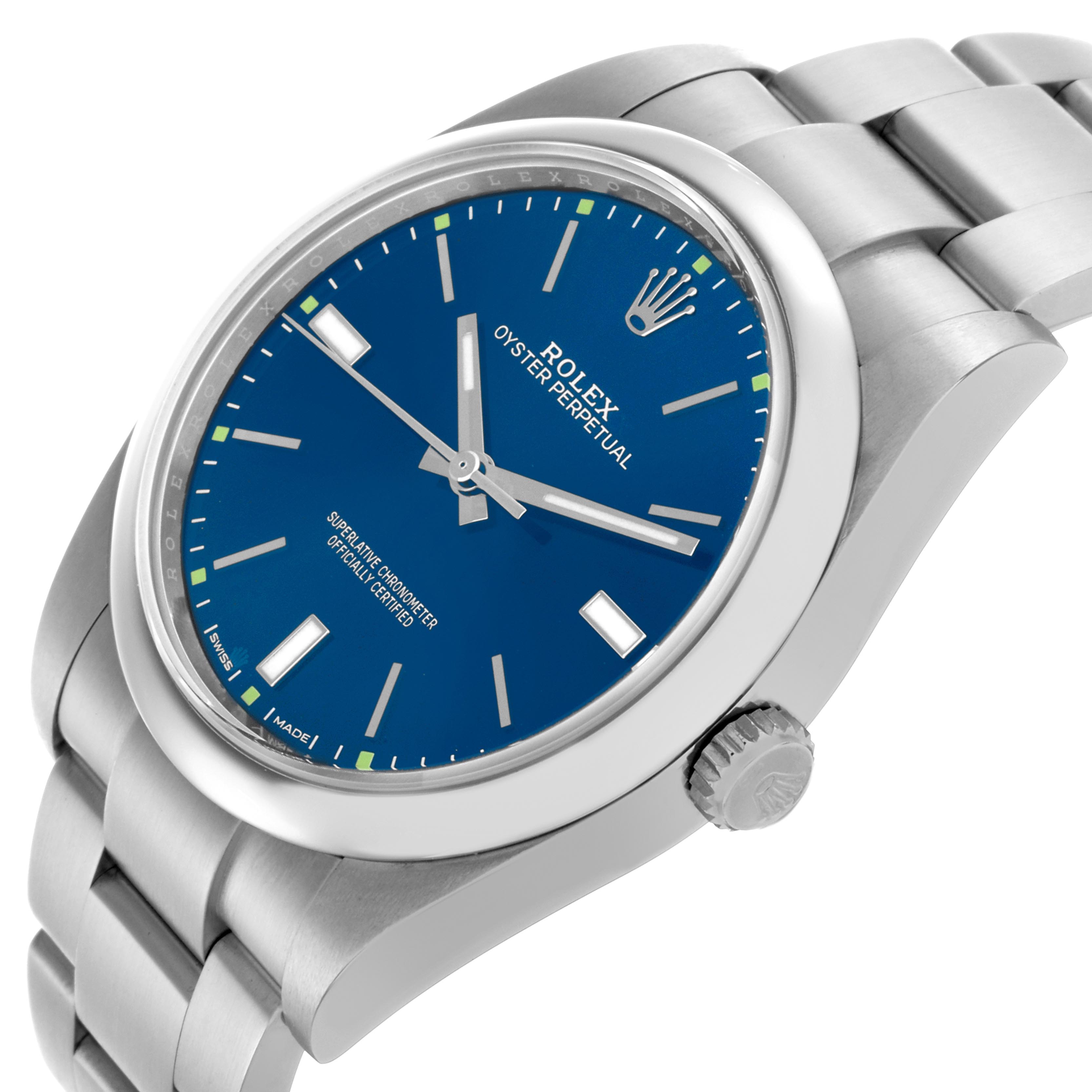 The Rolex Oyster Perpetual 114300 Men's Stainless Steel Blue Dial 114300 Men's Stainless Steel Blue Dial watch is shown at an angled view, displaying the face, crown, and part of the bracelet.