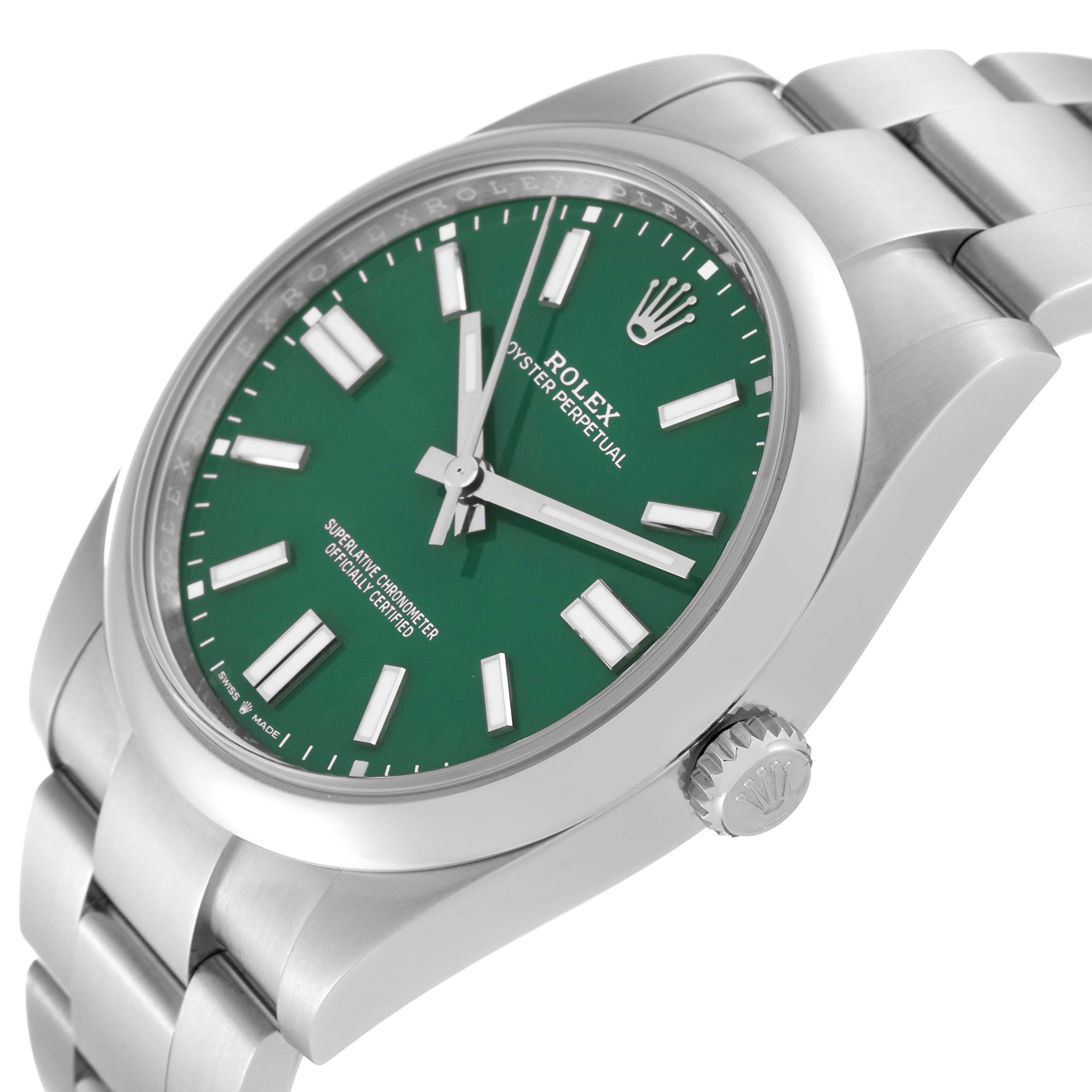 The image shows a Rolex Oyster Perpetual 124300 Men's Stainless Steel Green Dial 124300 Men's Stainless Steel Green Dial watch from an angled side view, displaying its green dial, crown, and metal bracelet.