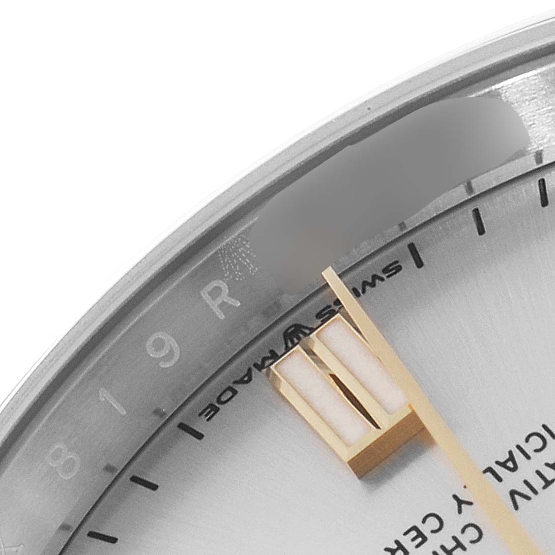 The image shows a close-up of the dial and bezel of the Rolex Oyster Perpetual 126000 Men's Stainless Steel Silver Dial 126000 Men's Stainless Steel Silver Dial watch, highlighting the hour markers and "Swiss Made" text.