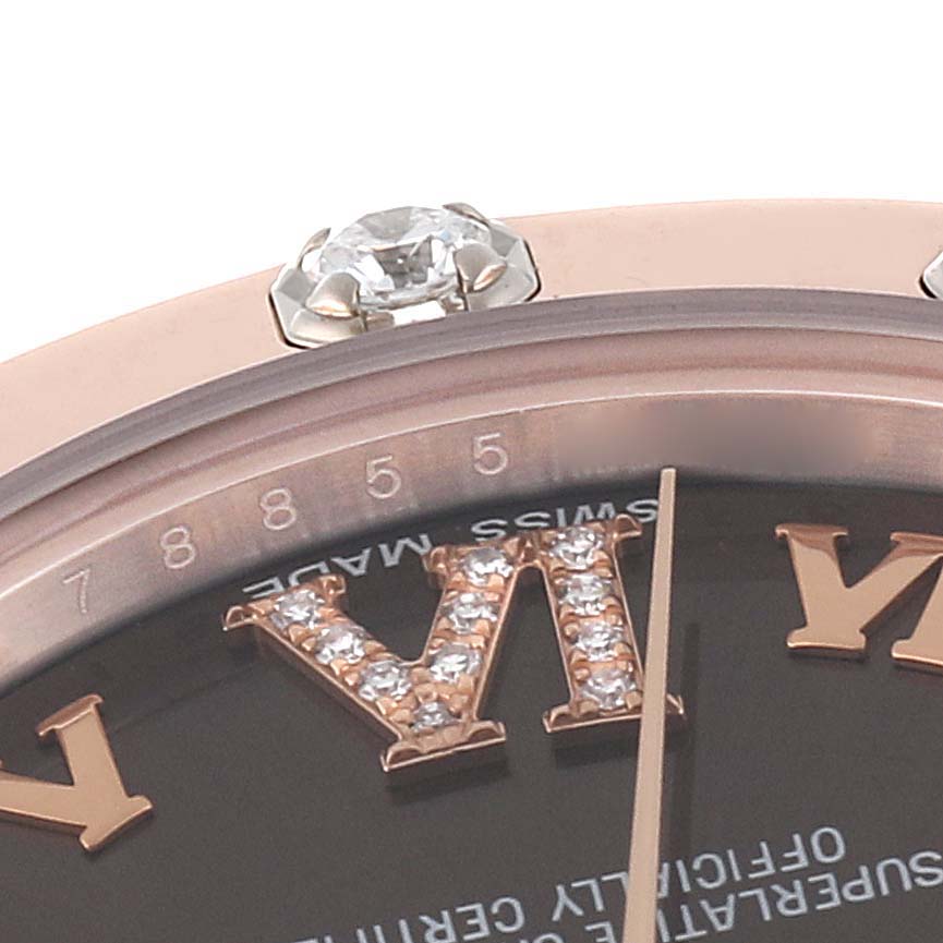 The close-up angle shows part of the bezel, diamond accents, and numerals of a Rolex Pearlmaster 81315 Women's Rose Gold Brown Dial 81315 Women's Rose Gold Brown Dial watch.