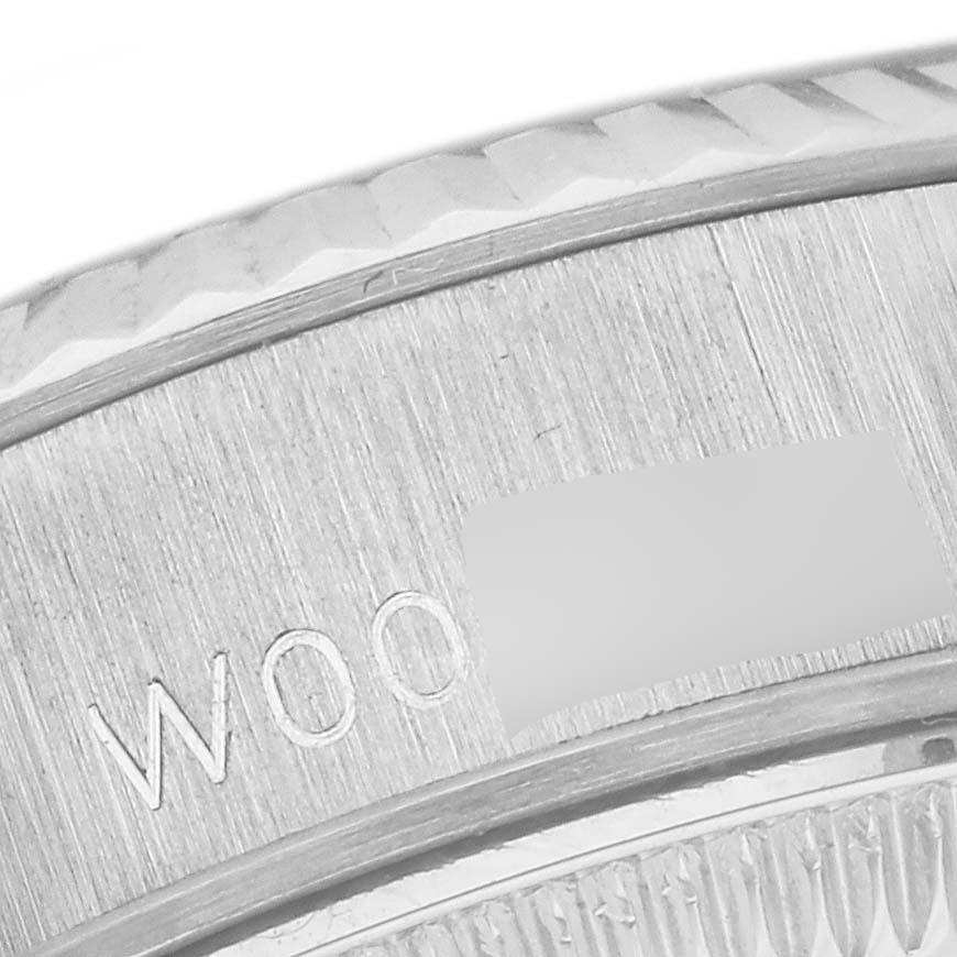 This image shows a close-up of the edge, bezel, and part of the dial of a Rolex President 69179G Women's White Gold Blue Dial 69179G Women's White Gold Blue Dial model watch.