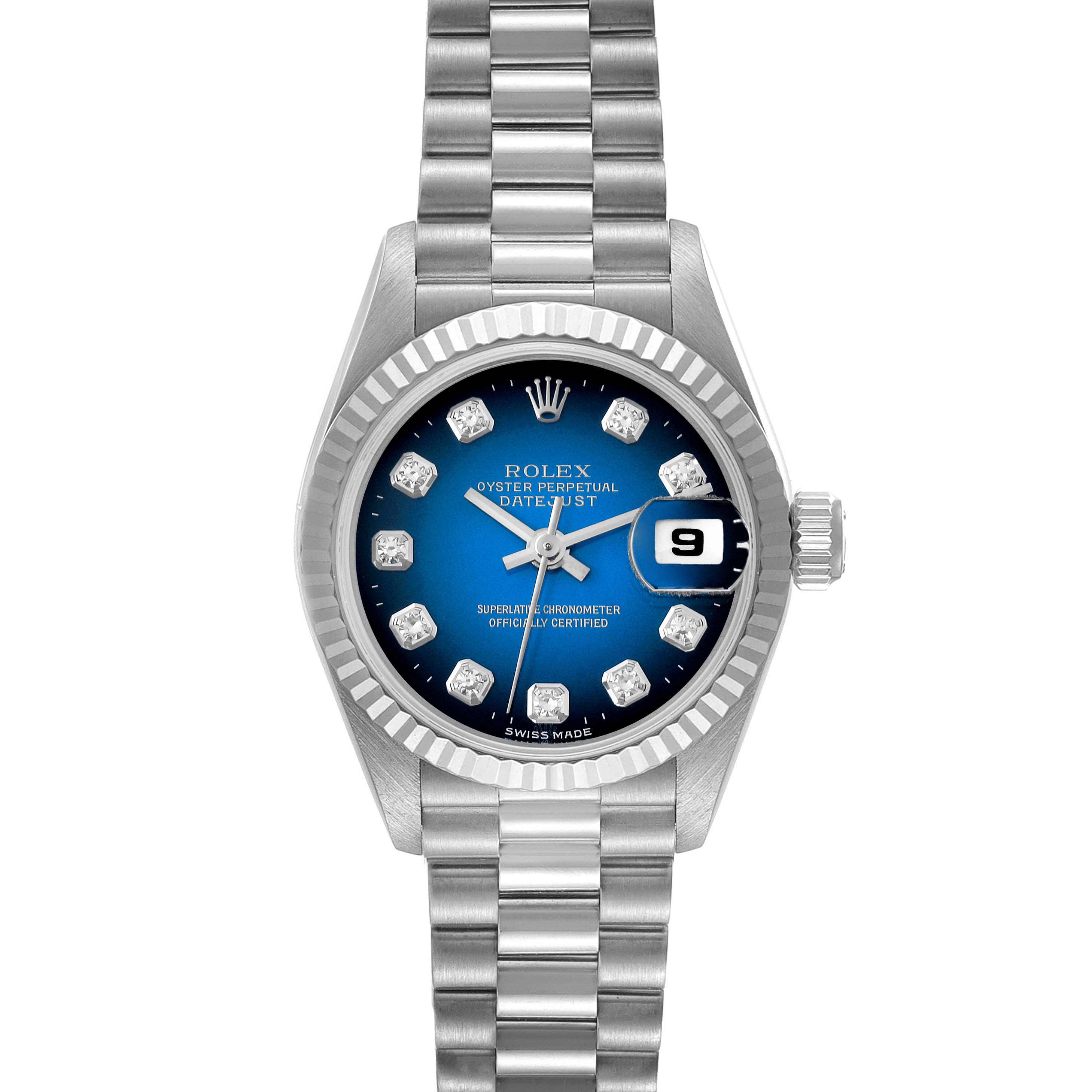 The image shows a Rolex President 69179G Women's White Gold Blue Dial 69179G Women's White Gold Blue Dial model watch with a blue dial, diamond hour markers, and a metal bracelet, viewed from the front.