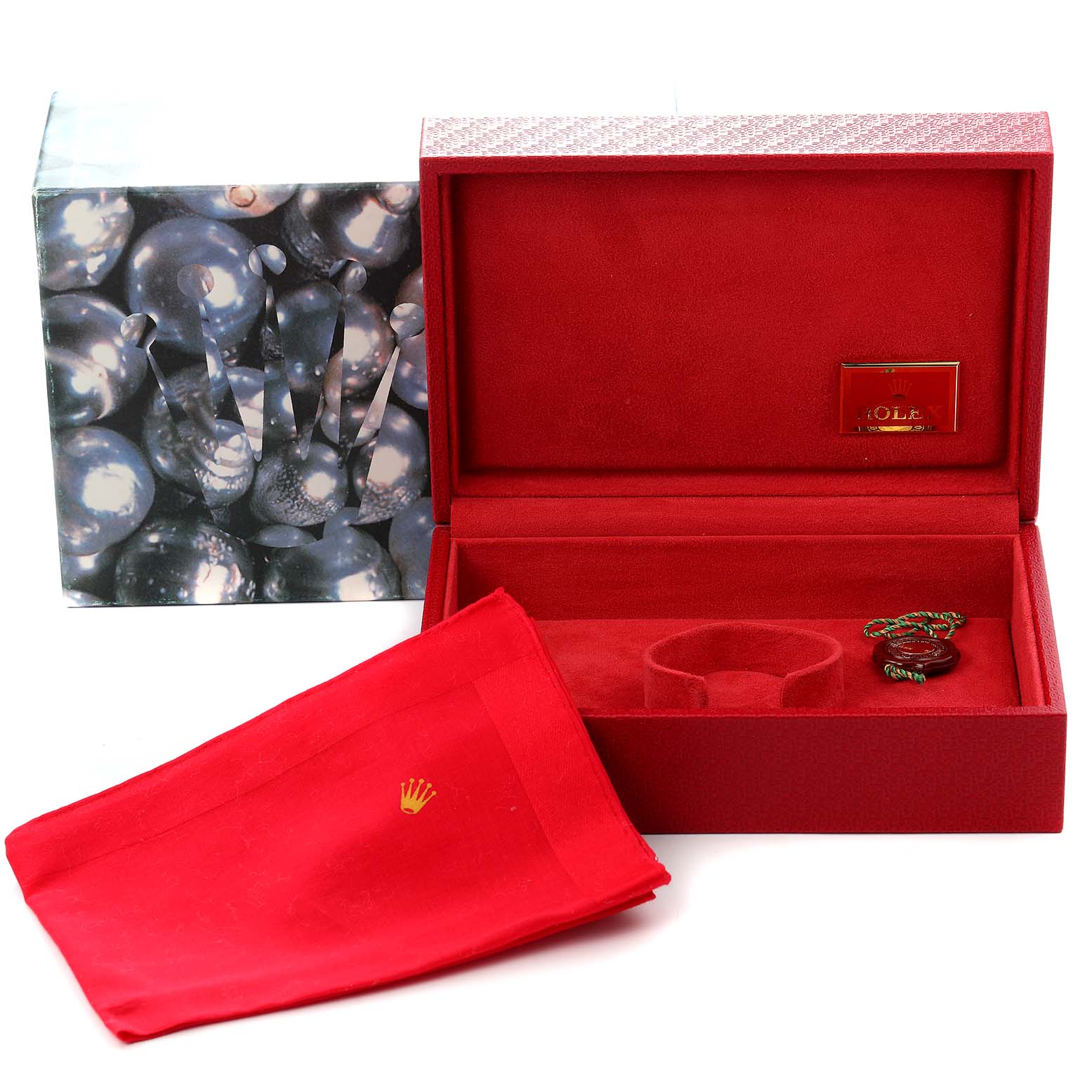 The image shows an open Rolex President 69179G Women's White Gold Blue Dial 69179G Women's White Gold Blue Dial watch box with a red interior, a cloth, and tags, viewed from the front.