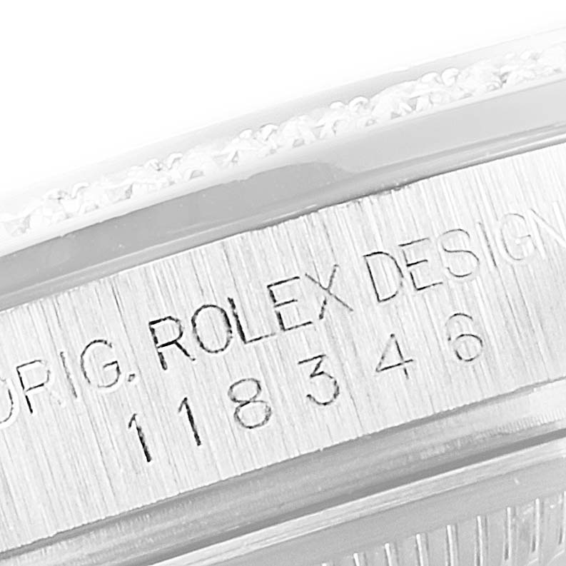 The image shows a close-up of the Rolex President 118346 Men's Platinum Blue Dial 118346 Men's Platinum Blue Dial model's case engraving, displaying the "Rolex Design" text and model number.
