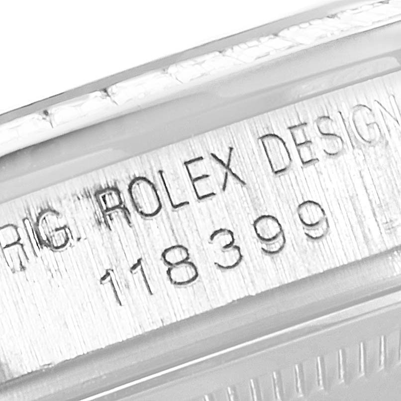 The image shows the engraved serial number on the side of a Rolex President 118399BR Men's White Gold Silver Dial 118399BR Men's White Gold Silver Dial model watch's case.