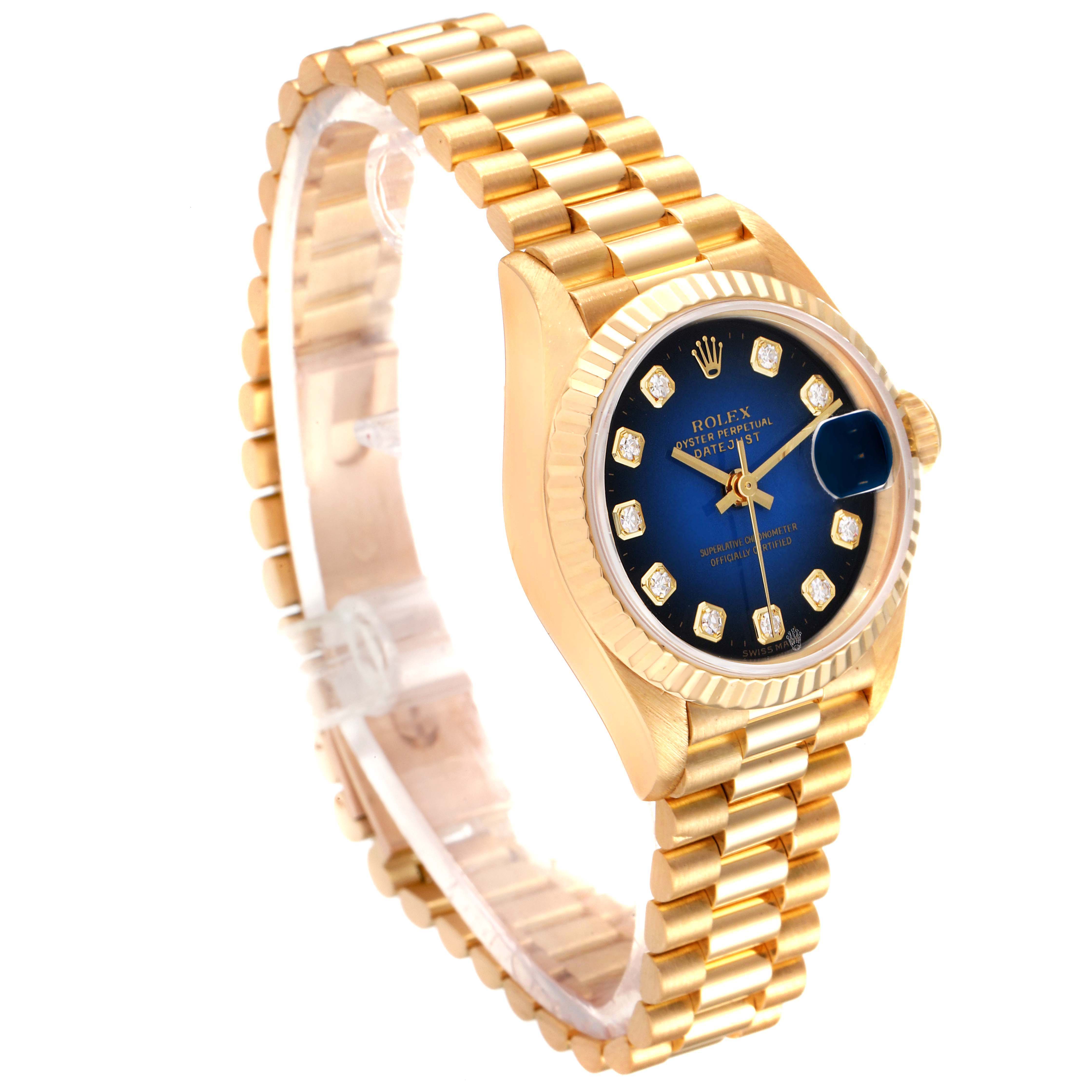 The Rolex President 69178 Women's Yellow Gold Blue Dial 69178 Women's Yellow Gold Blue Dial model watch is shown at a slight angle, featuring its gold bracelet, blue diamond dial, and fluted bezel.
