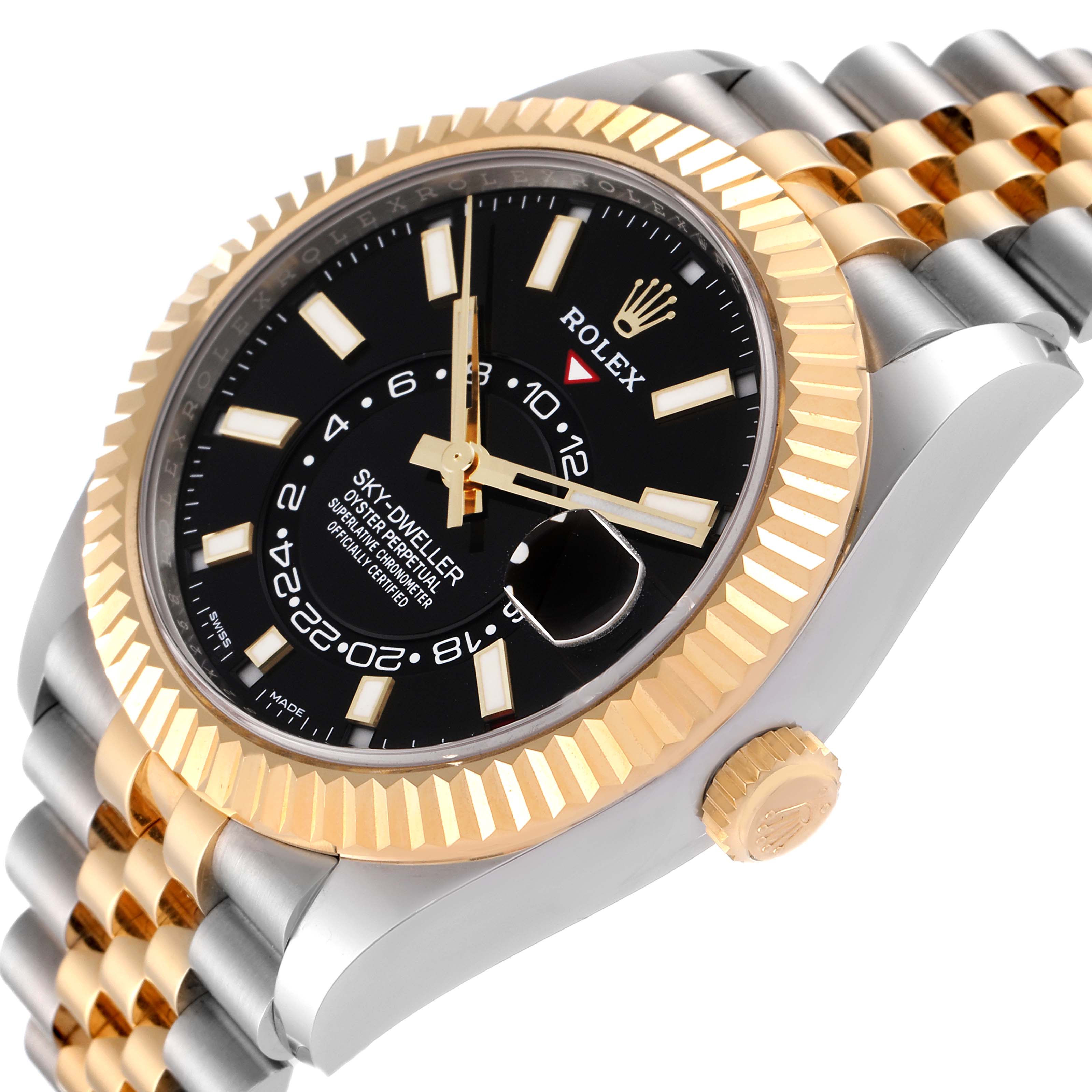 This image shows a Rolex Sky-Dweller 326933 Men's Steel and Gold (two tone) Black Dial 326933 Men's Steel and Gold (two tone) Black Dial watch at an angled side view, highlighting the black dial, gold bezel, and two-tone bracelet.