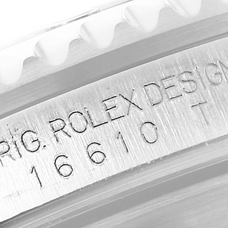 This close-up image shows the engraved model number (16610) and design details on the bezel of a Rolex Submariner 16610 Men
s Stainless Steel Black Dial 16610 Men
s Stainless Steel Black Dial watch.