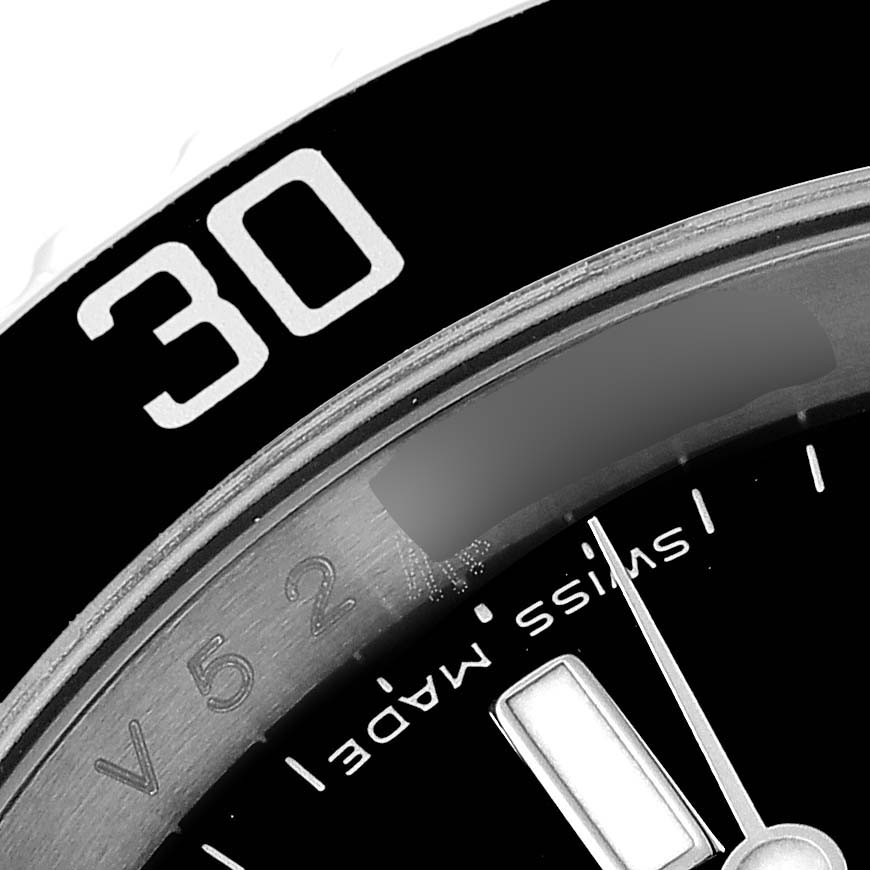 This close-up image shows the bezel and part of the dial of a Rolex Submariner 16610 Men
s Stainless Steel Black Dial 16610 Men
s Stainless Steel Black Dial watch.