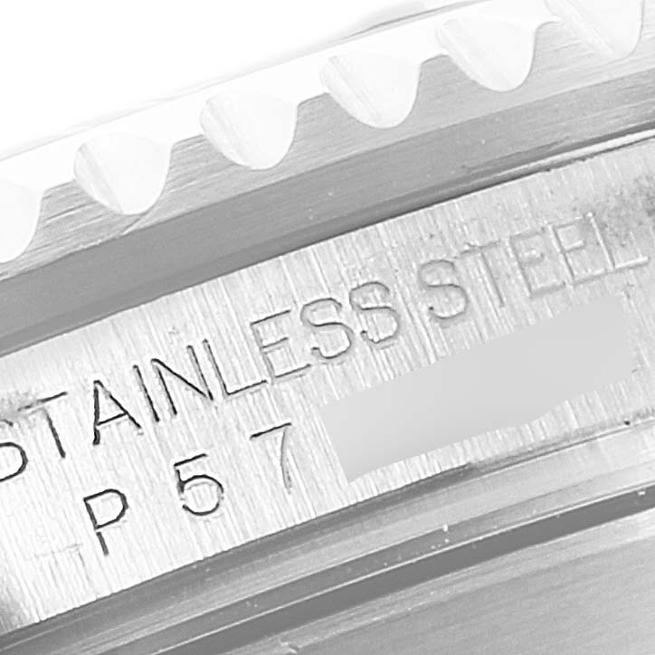 This close-up shows the stainless steel engraving and the bezel teeth of a Rolex Submariner 16610 Men's Stainless Steel Black Dial 16610 Men's Stainless Steel Black Dial.