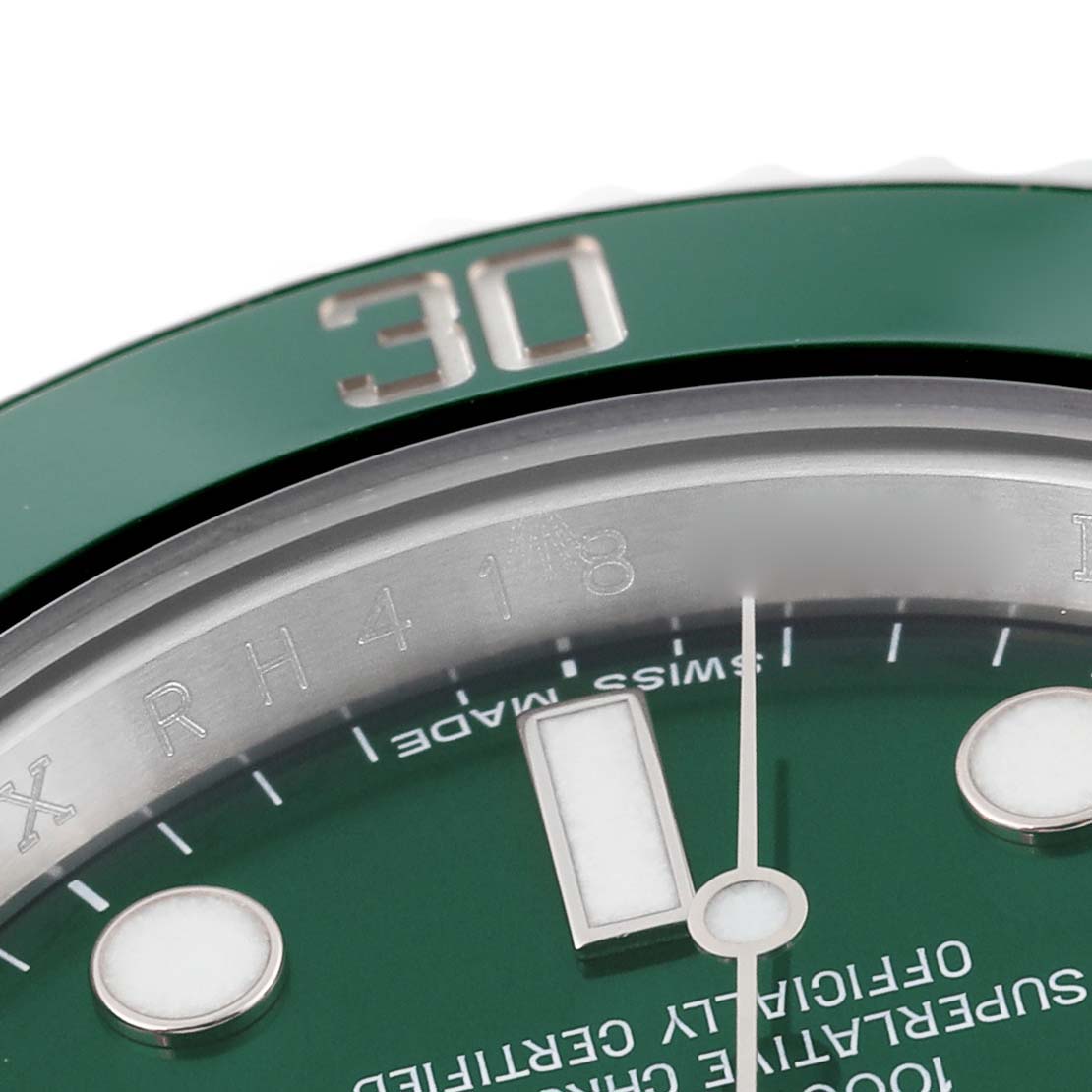 This close-up image of the Rolex Submariner 116610LV Men
s Stainless Steel Green Dial 116610LV Men
s Stainless Steel Green Dial watch shows part of its green bezel, the hour marker, and the dial with text.