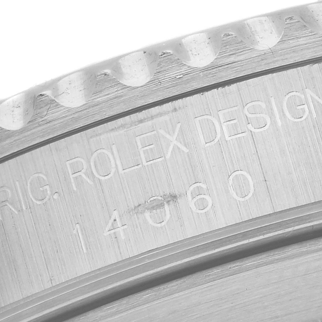 This is a close-up shot of the case and engraved serial number on a Rolex Submariner 14060 Men
s Stainless Steel Black Dial 14060 Men
s Stainless Steel Black Dial watch.