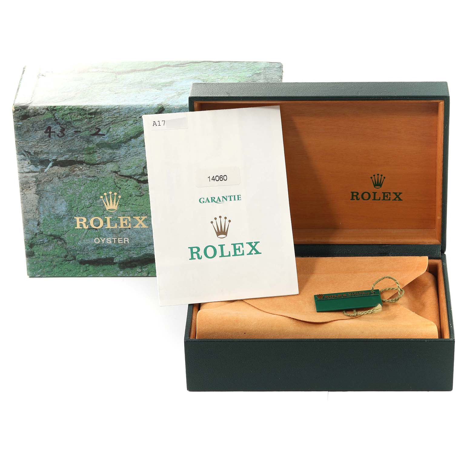 The image shows a Rolex Submariner 14060 Men
s Stainless Steel Black Dial 14060 Men
s Stainless Steel Black Dial watch box, guarantee paper, and packaging, all arranged for display.