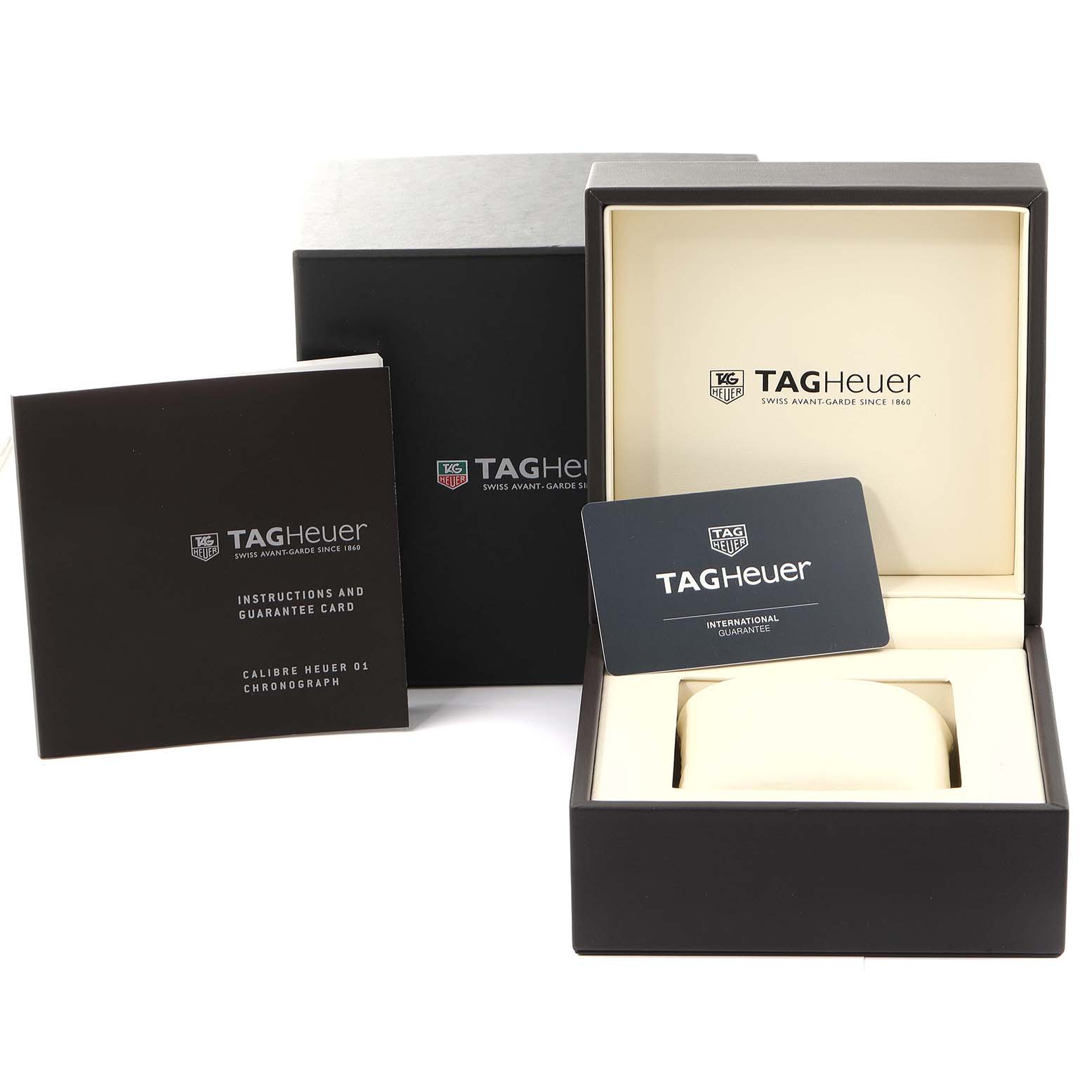 The image shows the open box, instruction manual, and guarantee card for a Tag Heuer Carrera CAR2A8A.FT6072 Men's Titanium Grey Dial CAR2A8A.FT6072 Men's Titanium Grey Dial watch.