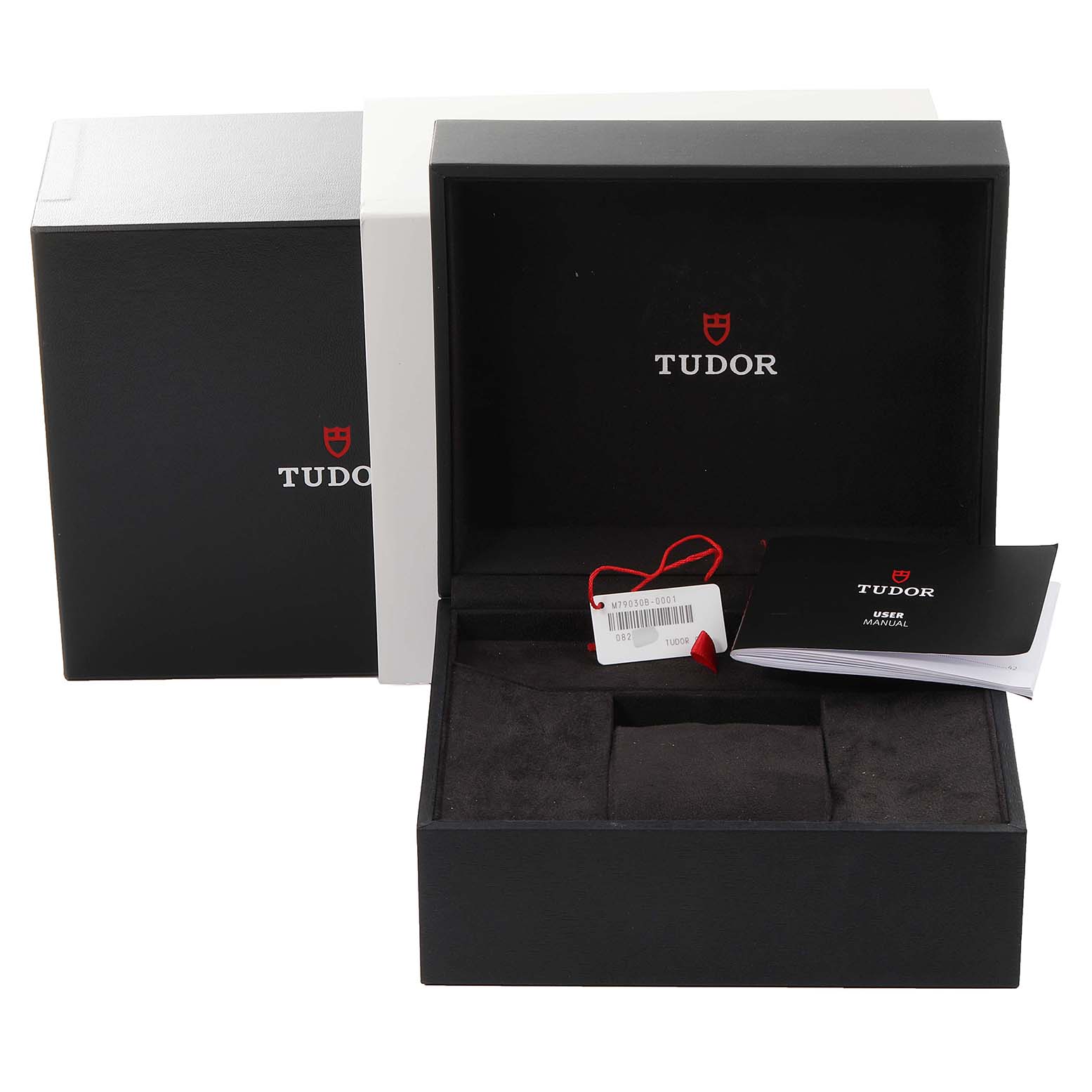 The image shows the open box, hang tag, and user manual for the Tudor Heritage Black Bay 79030B Men
s Stainless Steel Blue Dial 79030B Men
s Stainless Steel Blue Dial watch model.