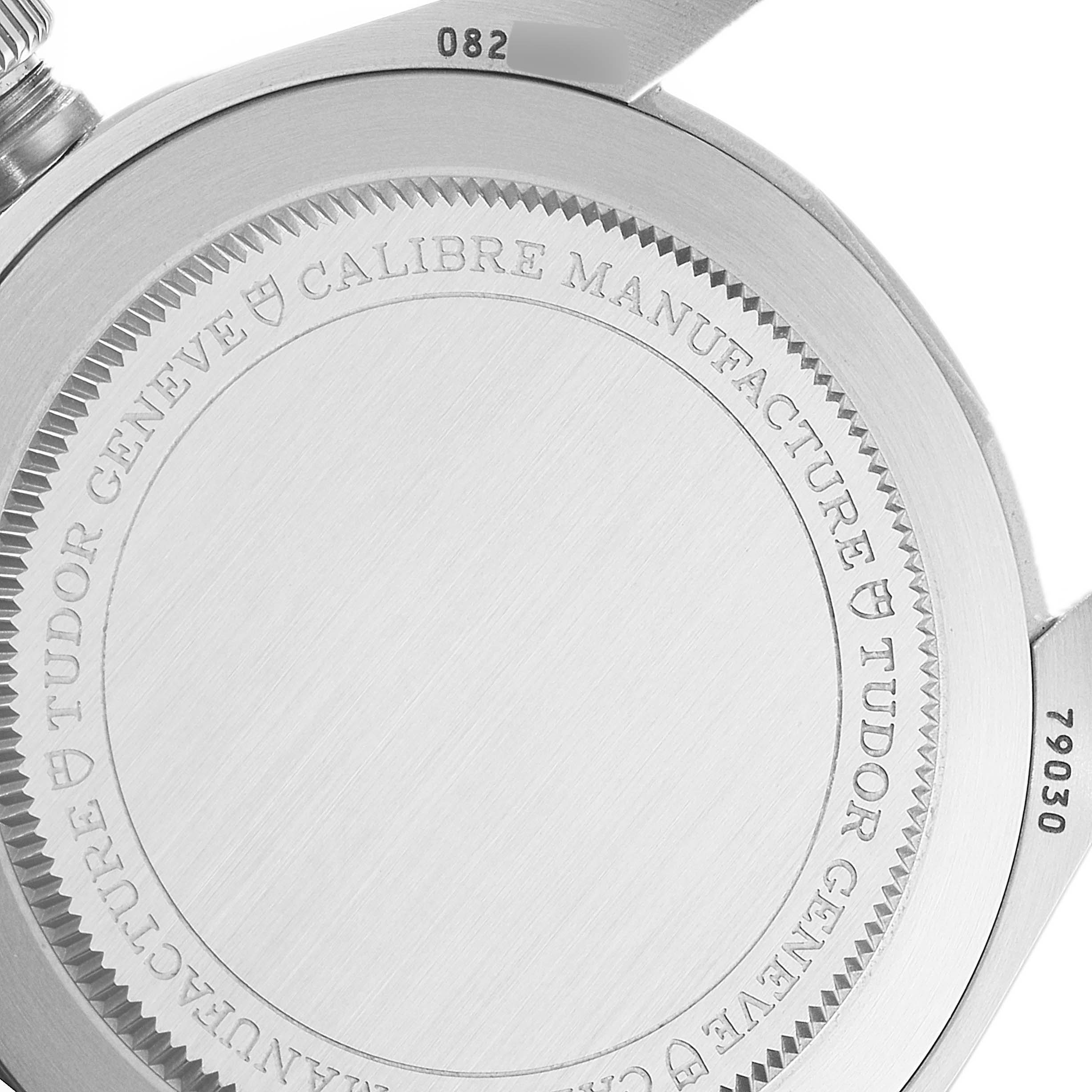 This image shows the case back of a Tudor Heritage Black Bay 79030B Men
s Stainless Steel Blue Dial 79030B Men
s Stainless Steel Blue Dial watch, highlighting the engraved details.