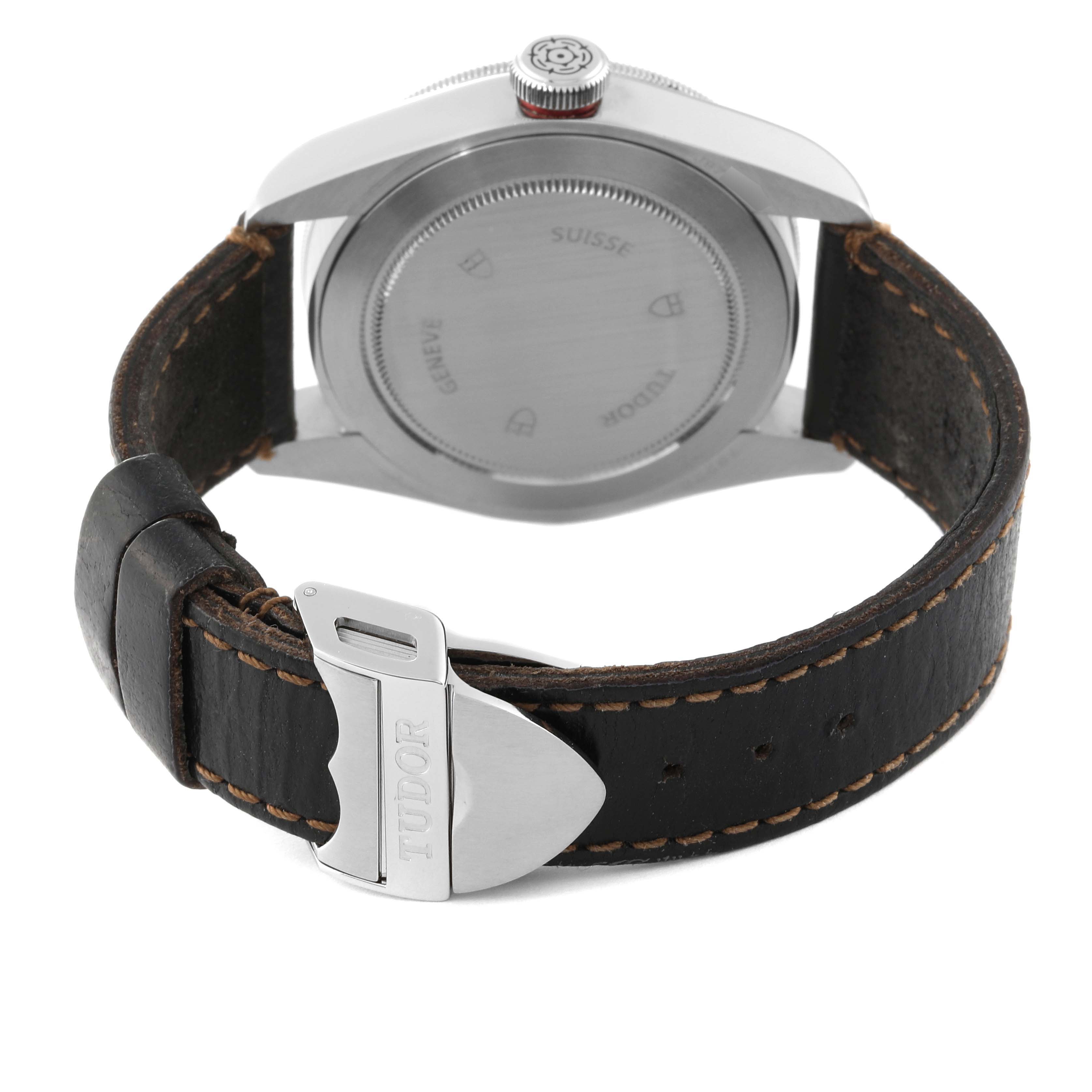 The image shows the back case and leather strap of a Tudor Heritage Black Bay 79220R Men
s Stainless Steel Black Dial 79220R Men
s Stainless Steel Black Dial watch.