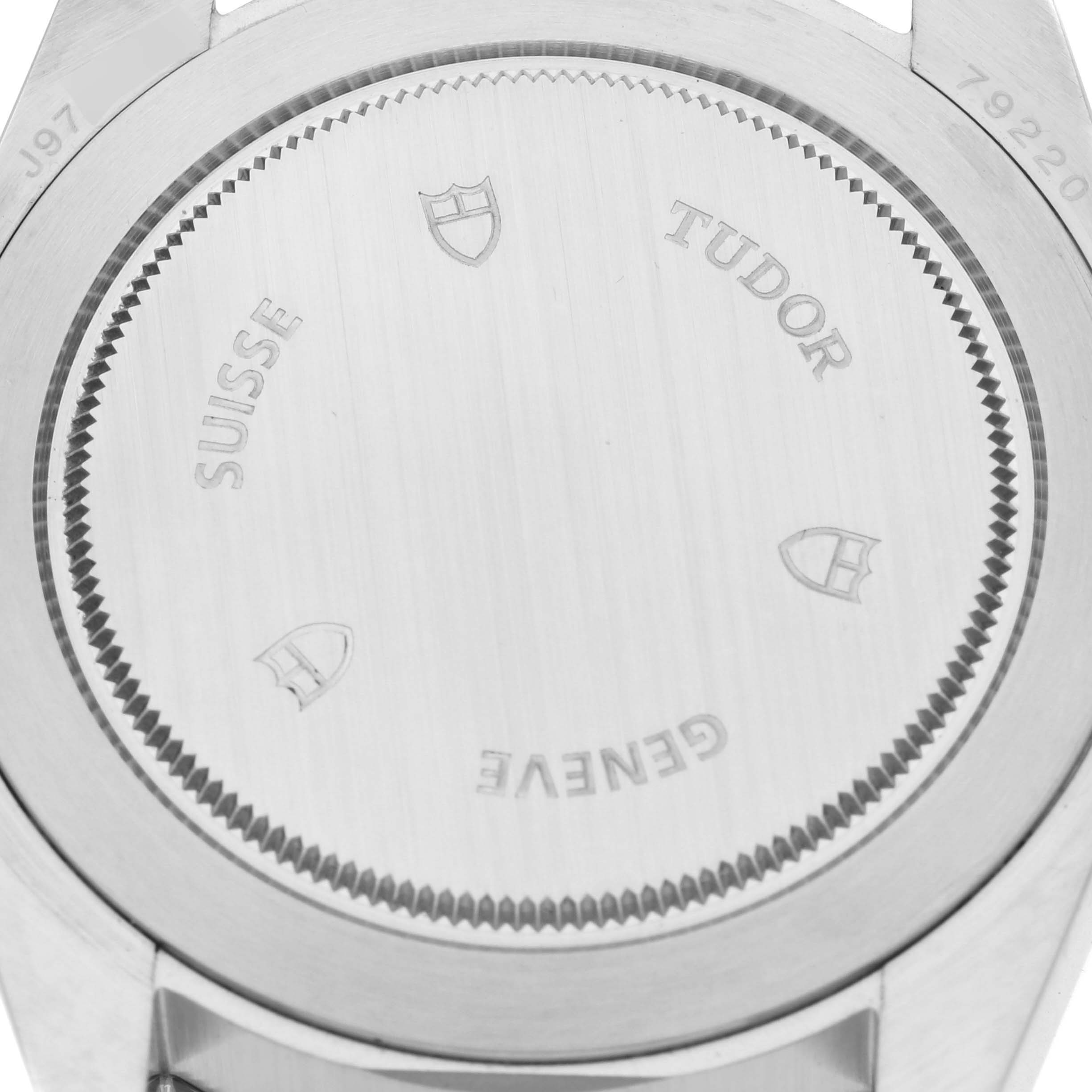 This image shows the case back of the Tudor Heritage Black Bay 79220R Men
s Stainless Steel Black Dial 79220R Men
s Stainless Steel Black Dial watch from a straight-on angle.