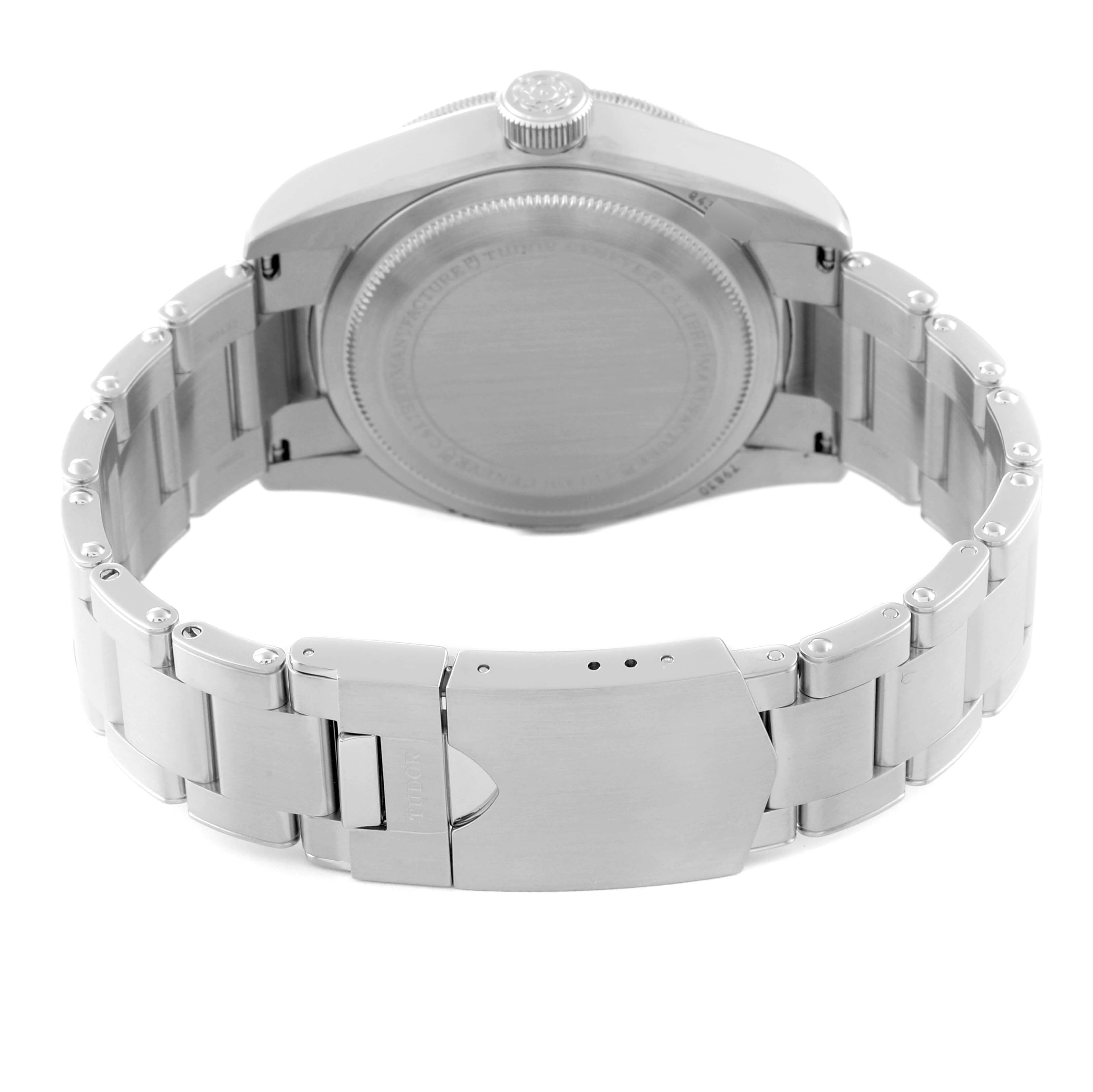 The image shows the back view of a Tudor Heritage Black Bay 79830RB Men
s Stainless Steel Black Dial 79830RB Men
s Stainless Steel Black Dial watch, highlighting the case back and metal bracelet with clasp.