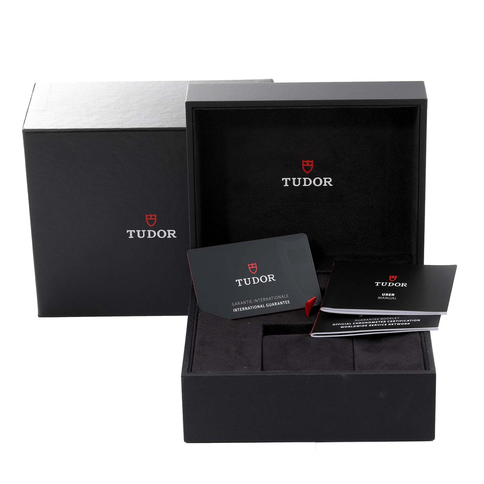 The image shows the packaging, user manual, and international guarantee card for the Tudor Heritage Black Bay 79830RB Men
s Stainless Steel Black Dial 79830RB Men
s Stainless Steel Black Dial watch.