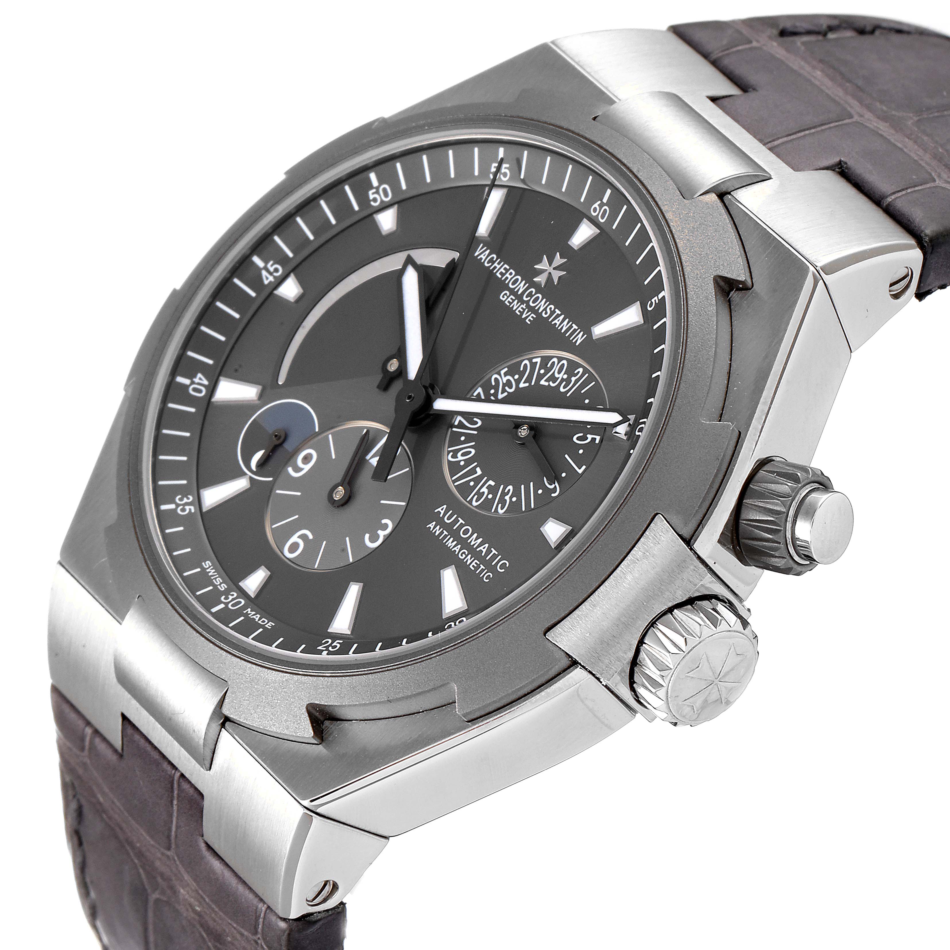 The image shows the Vacheron Constantin Overseas 47450/000W-9511 Men's Stainless Steel Grey Dial 47450/000W-9511 Men's Stainless Steel Grey Dial watch at a slight angle, highlighting the face, crown, and part of the strap.